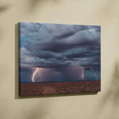Canvas print of multiple vivid lightning bolts striking a desert under dark blue thunderclouds dramatic landscape wall decor