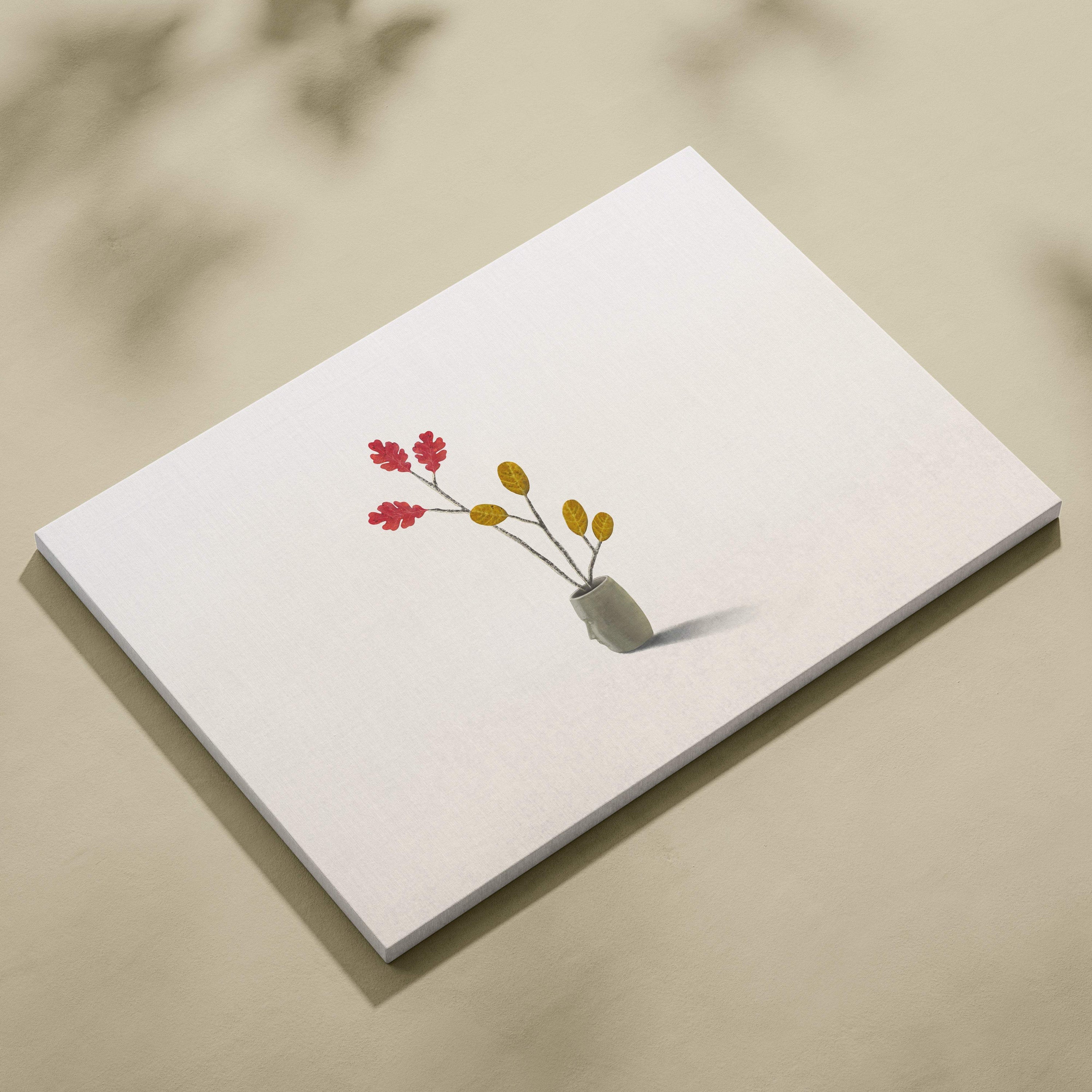 A minimalist white canvas wall art featuring red and yellow leaf branches in a small gray ceramic vase for modern decor