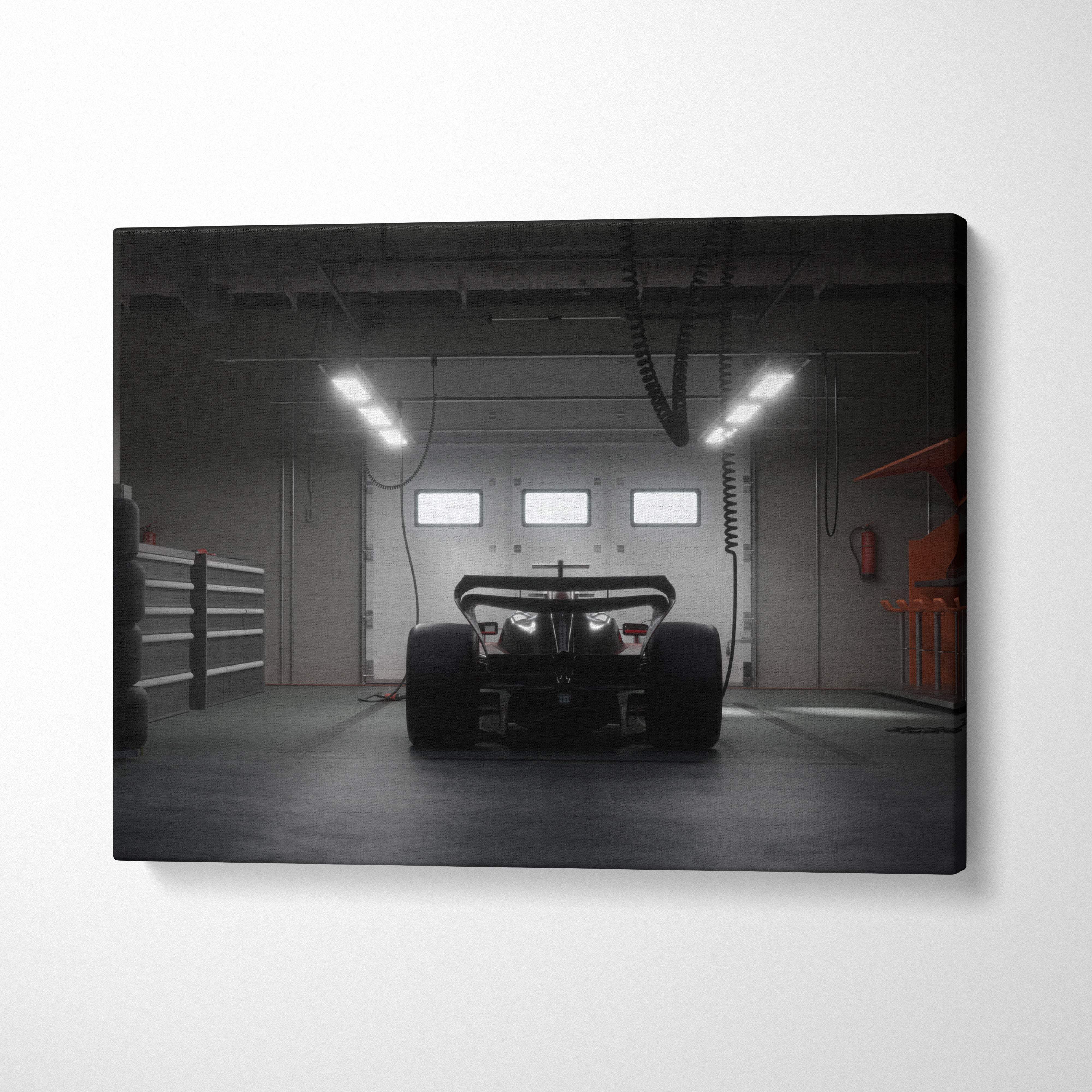 Dark formula race car canvas wall art print showing rear view of black car in dimly lit garage for modern racing decor