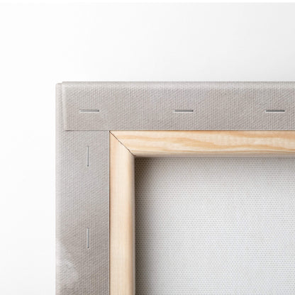 Light gray canvas stretched over natural wood frame with visible stitching on the back of soft neutral floral wall art