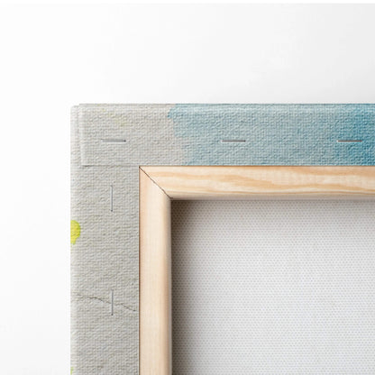 Back of pastel watercolor landscape canvas wall art in light wood frame with textured backing and blue gradient