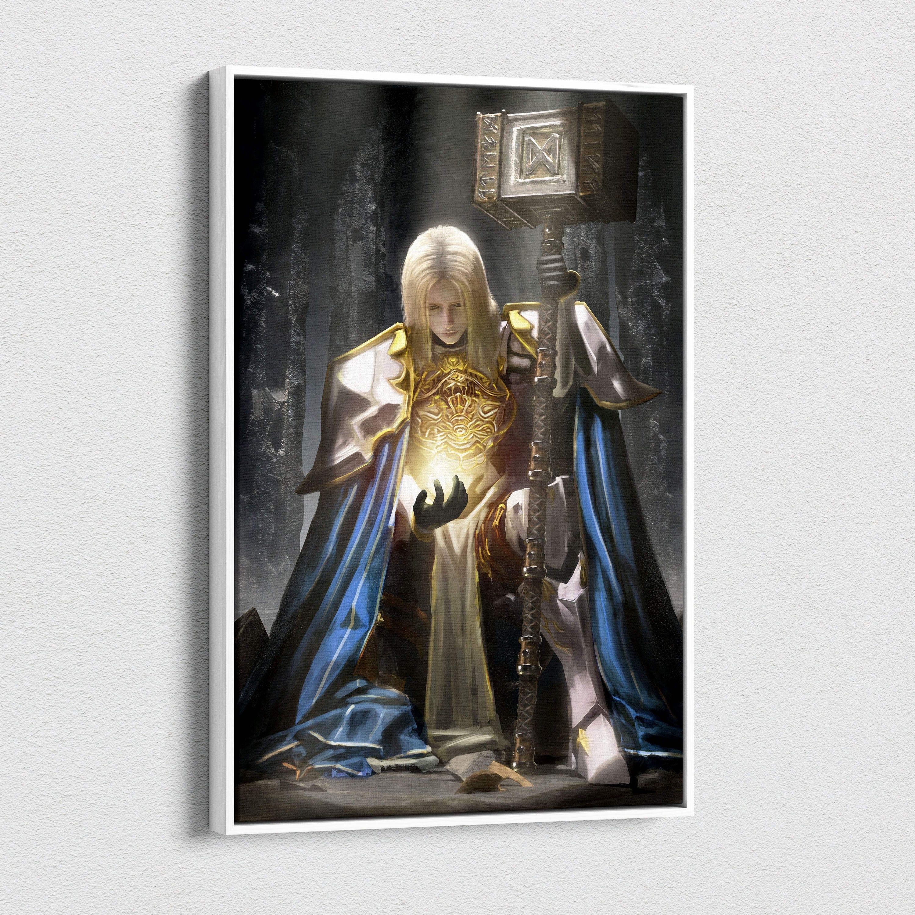 A framed canvas wall art of a holy paladin knight in golden armor and blue robes holding a detailed hammer