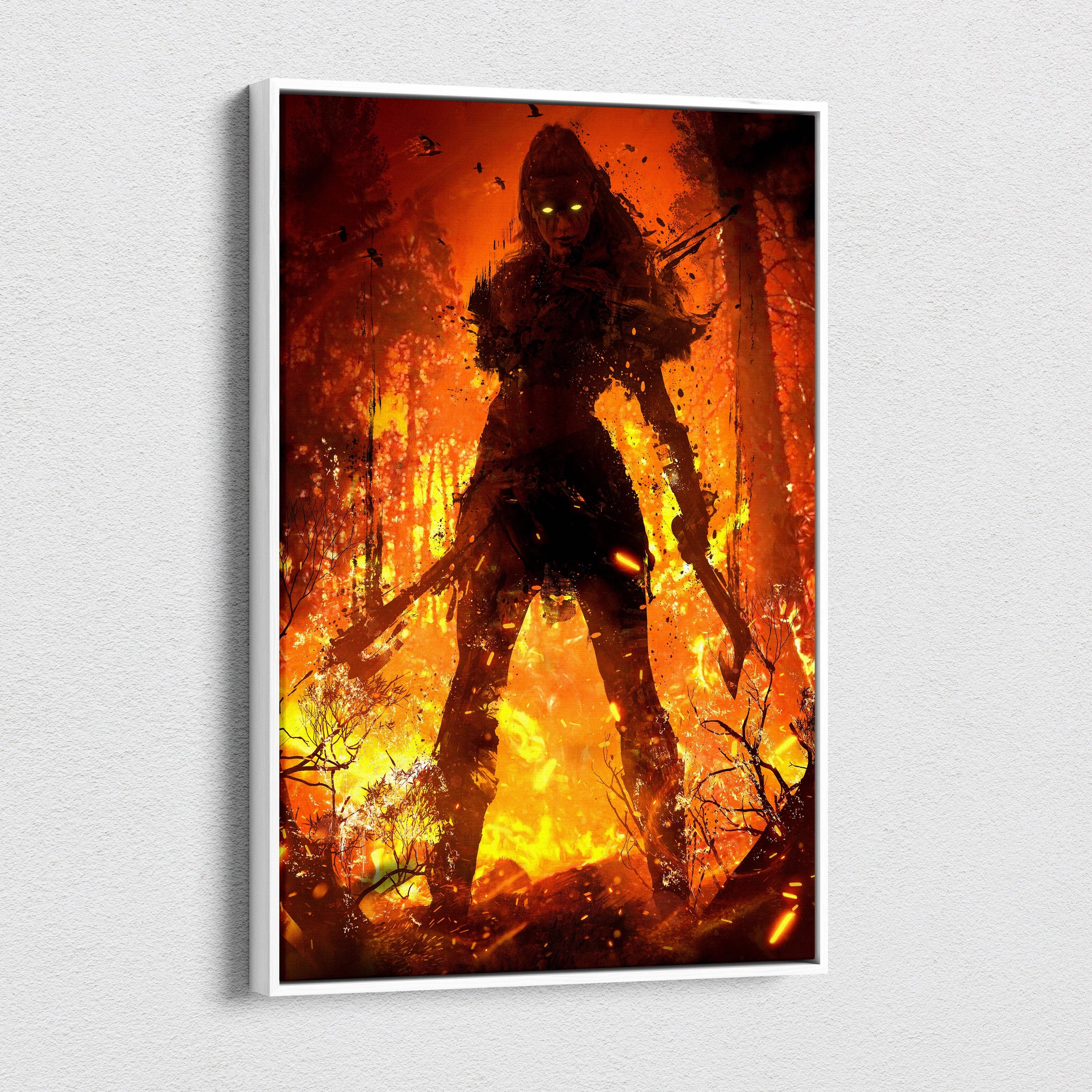 A framed canvas print of a dark female warrior with glowing yellow eyes and dual blades in a fiery forest scene