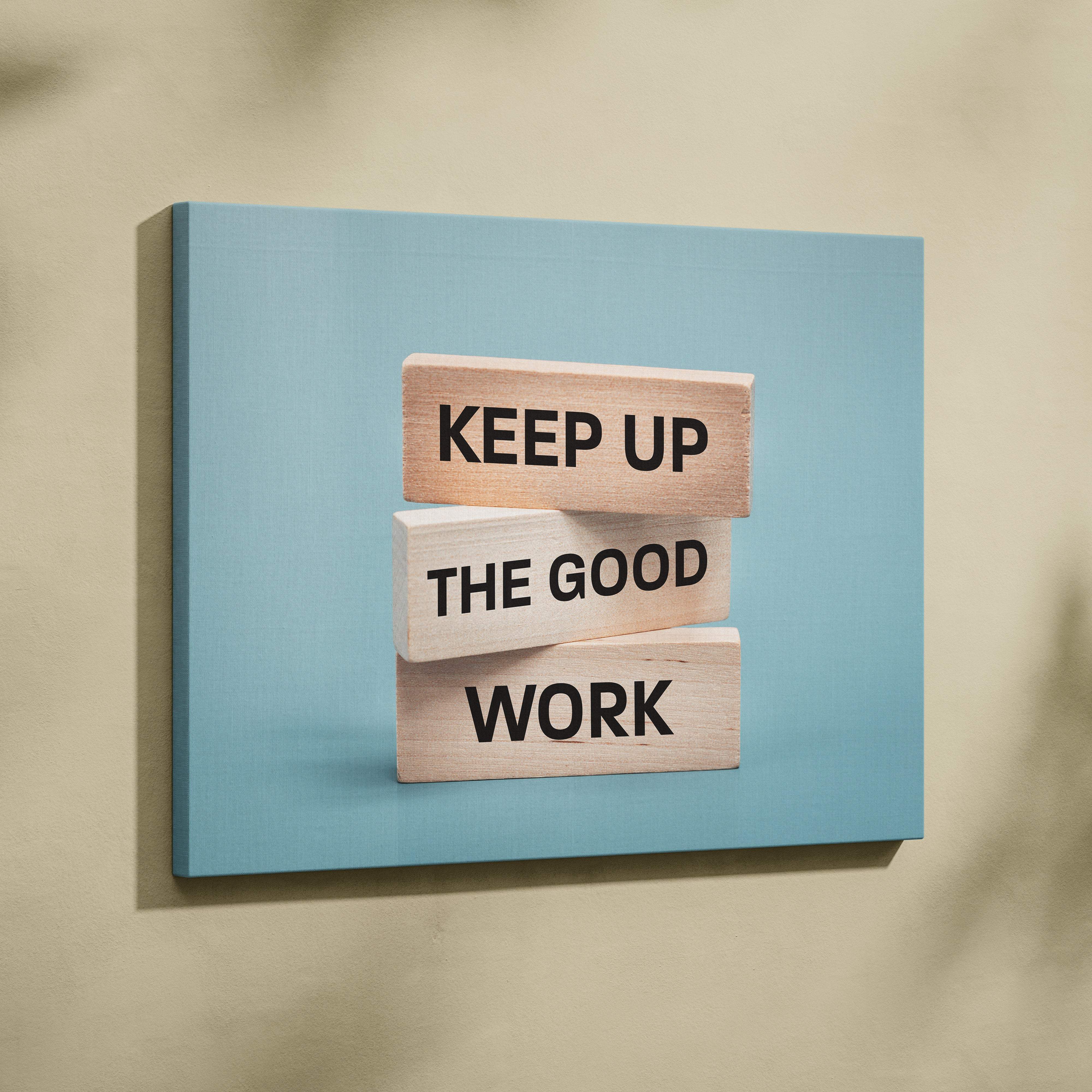 Three light wood blocks with black text keep up the good work on blue canvas for motivational office wall art print
