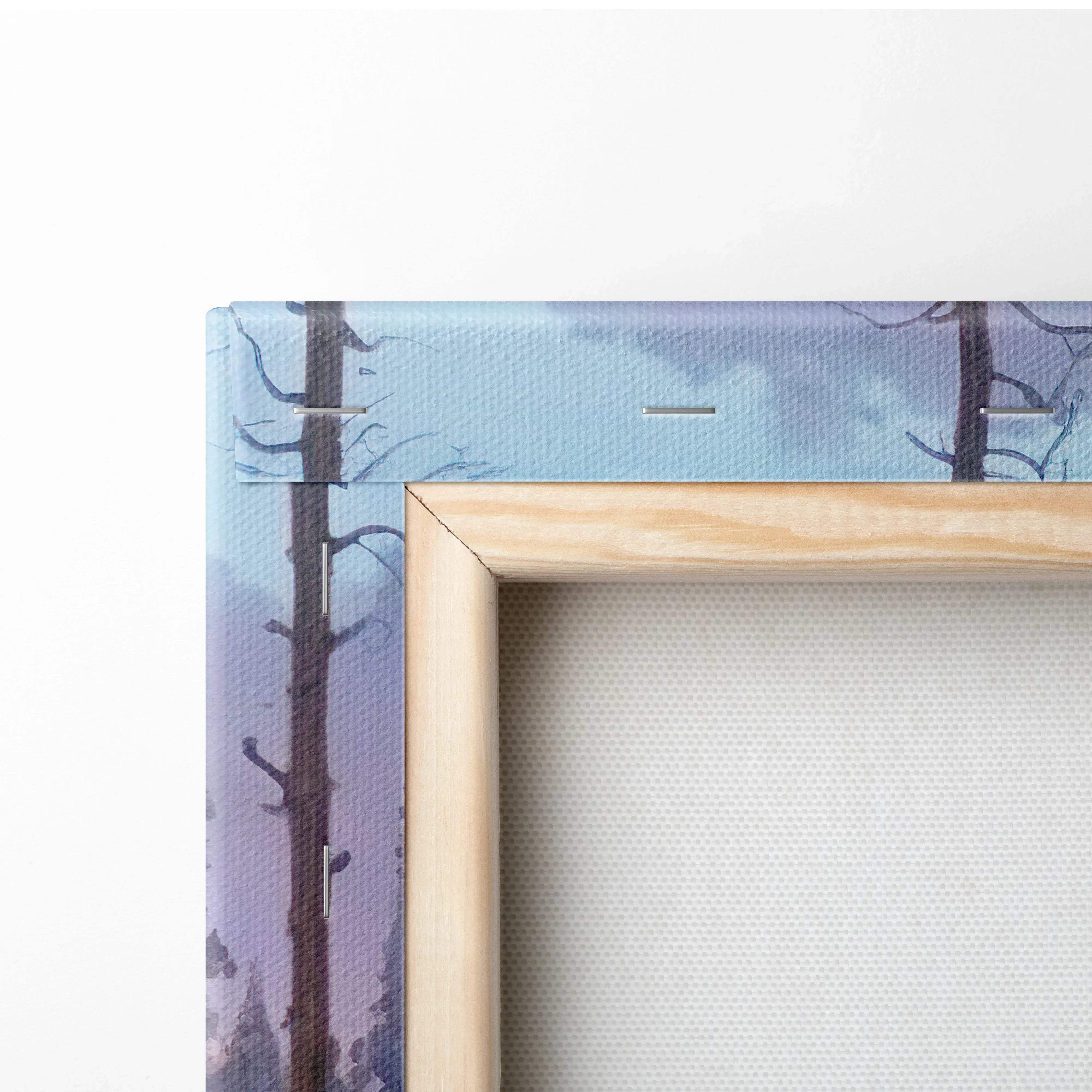 Light wood-framed canvas print of watercolor forest sunset with tall dark trees and golden hour glow over rocky river