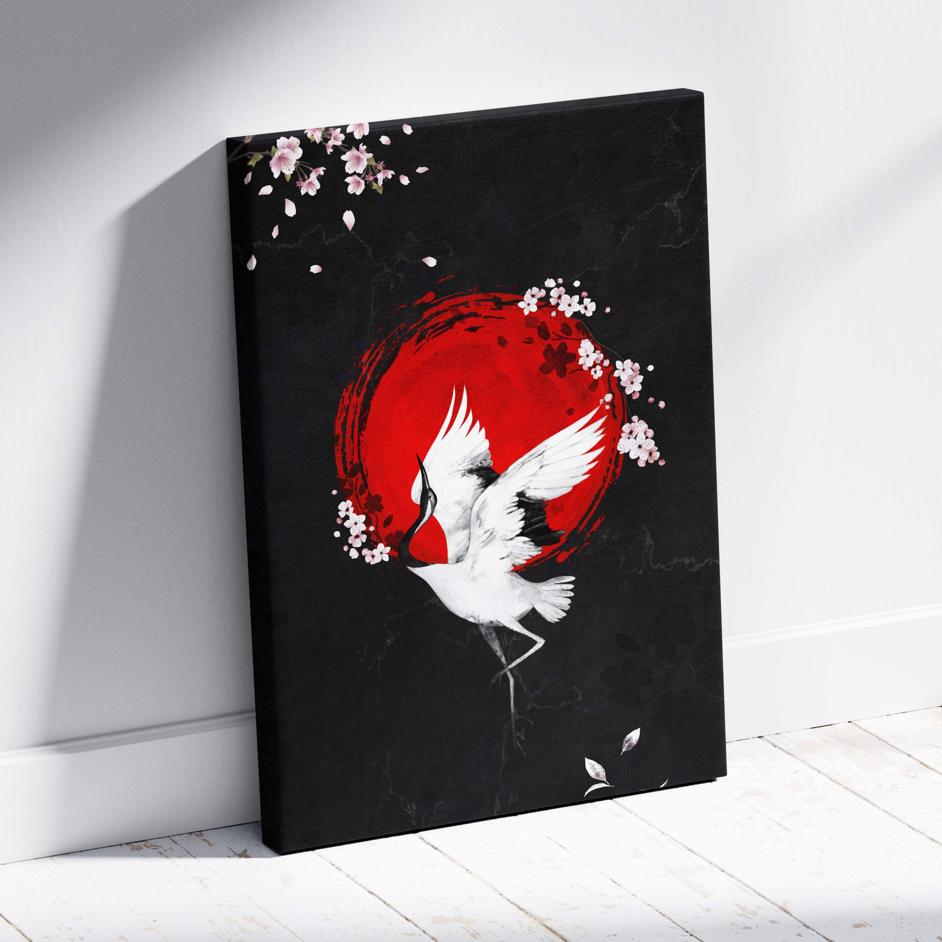 Black red crane canvas wall art featuring white crane in flight with pink cherry blossoms on bold red circle background