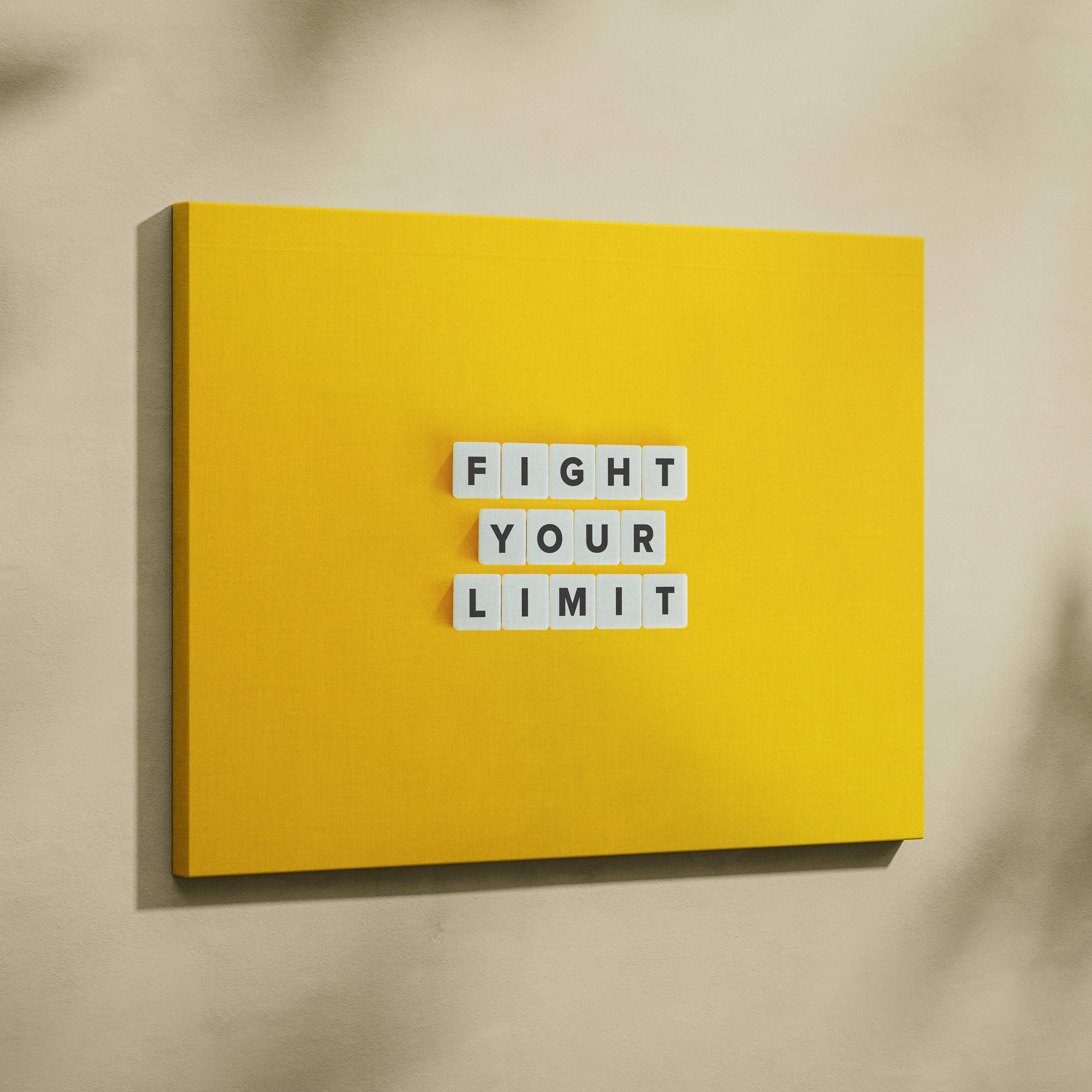 Bright yellow canvas wall art with fight your limit white letter tiles motivational quote for gym office or home decor