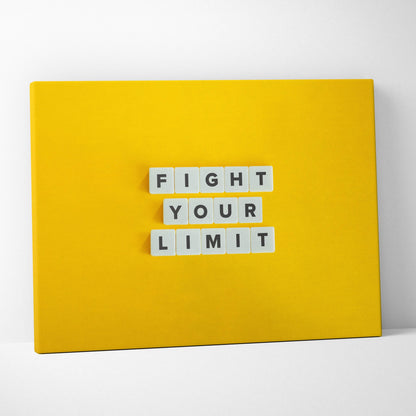 Bright yellow canvas wall art with white letter tiles spelling fight your limit motivational gym office decor