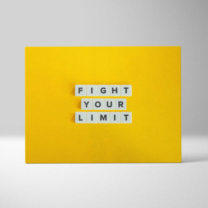 Bright yellow motivational wall art print with white letter tiles spelling fight your limit for gym or home decor