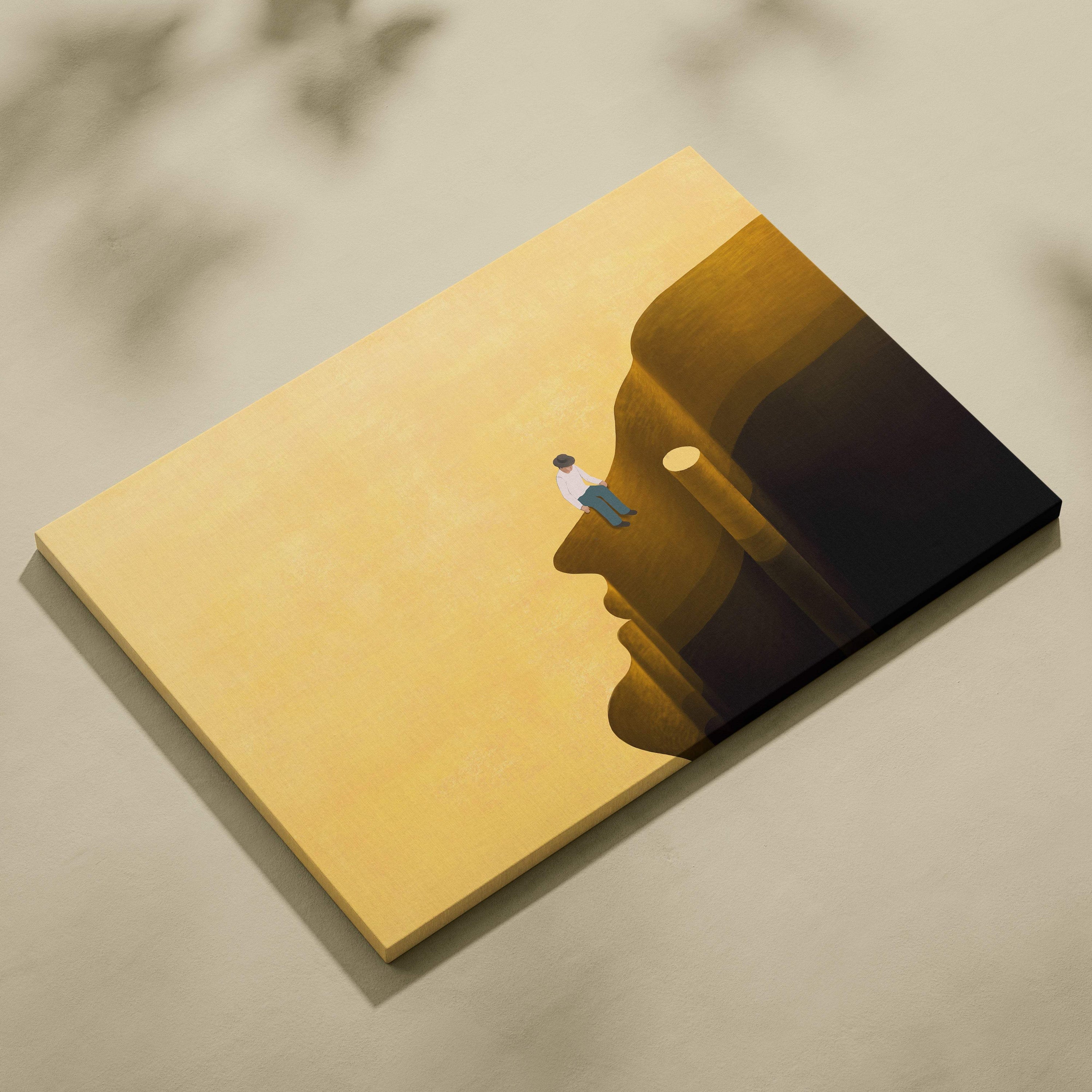 Contemporary man on head canvas wall art featuring warm golden and dark brown minimalist face with seated figure