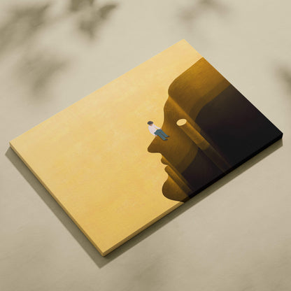 Contemporary man on head canvas wall art featuring warm golden and dark brown minimalist face with seated figure
