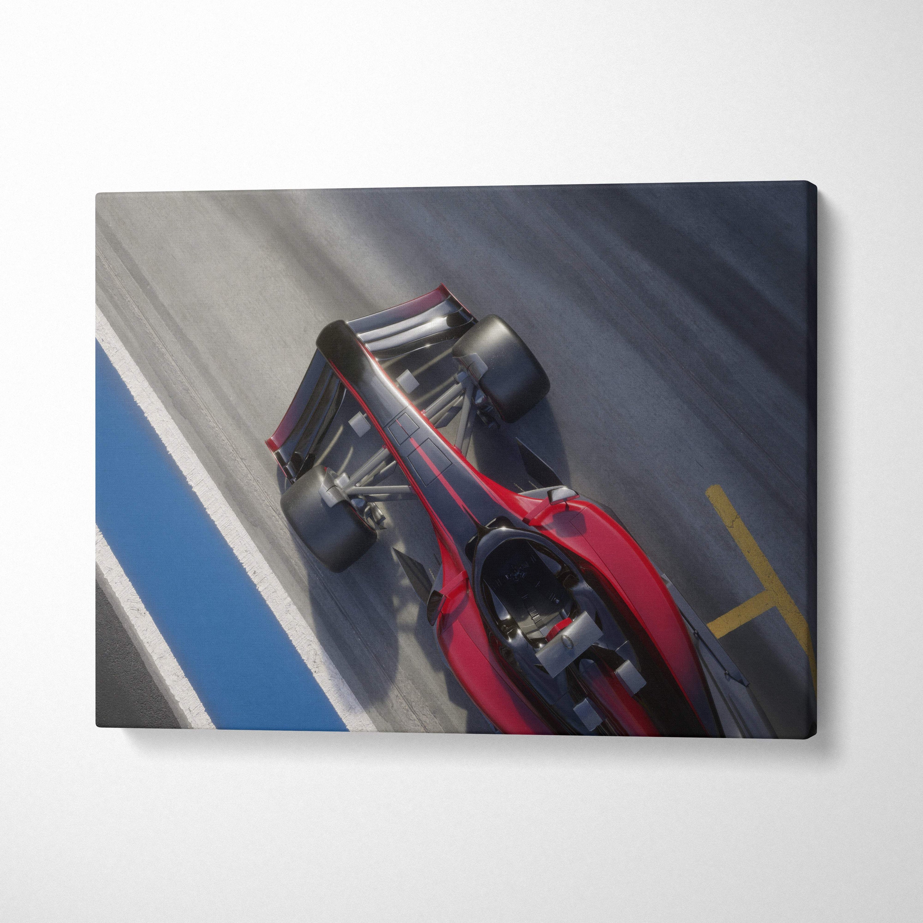 Red and black formula 1 race car canvas wall art print featuring overhead motorsport track photography style decor