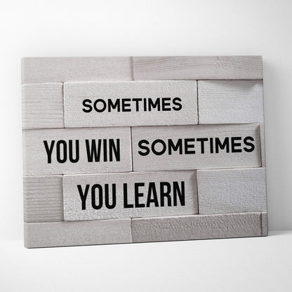 Gray wooden plank wall art with black text sometimes you win sometimes you learn motivational quote for home or office decor