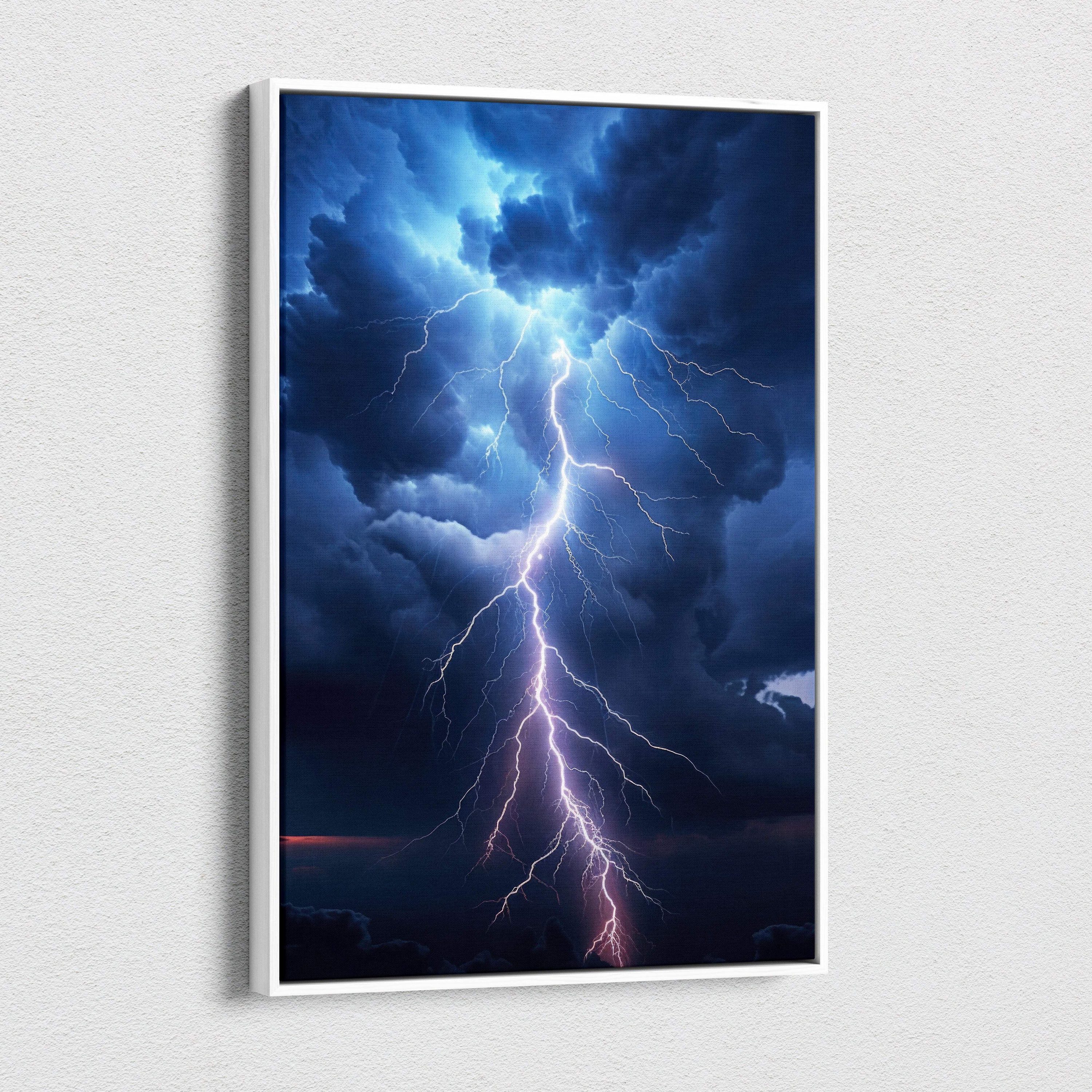 A framed lightning storm canvas art featuring a dramatic lightning bolt through dark blue and purple storm clouds