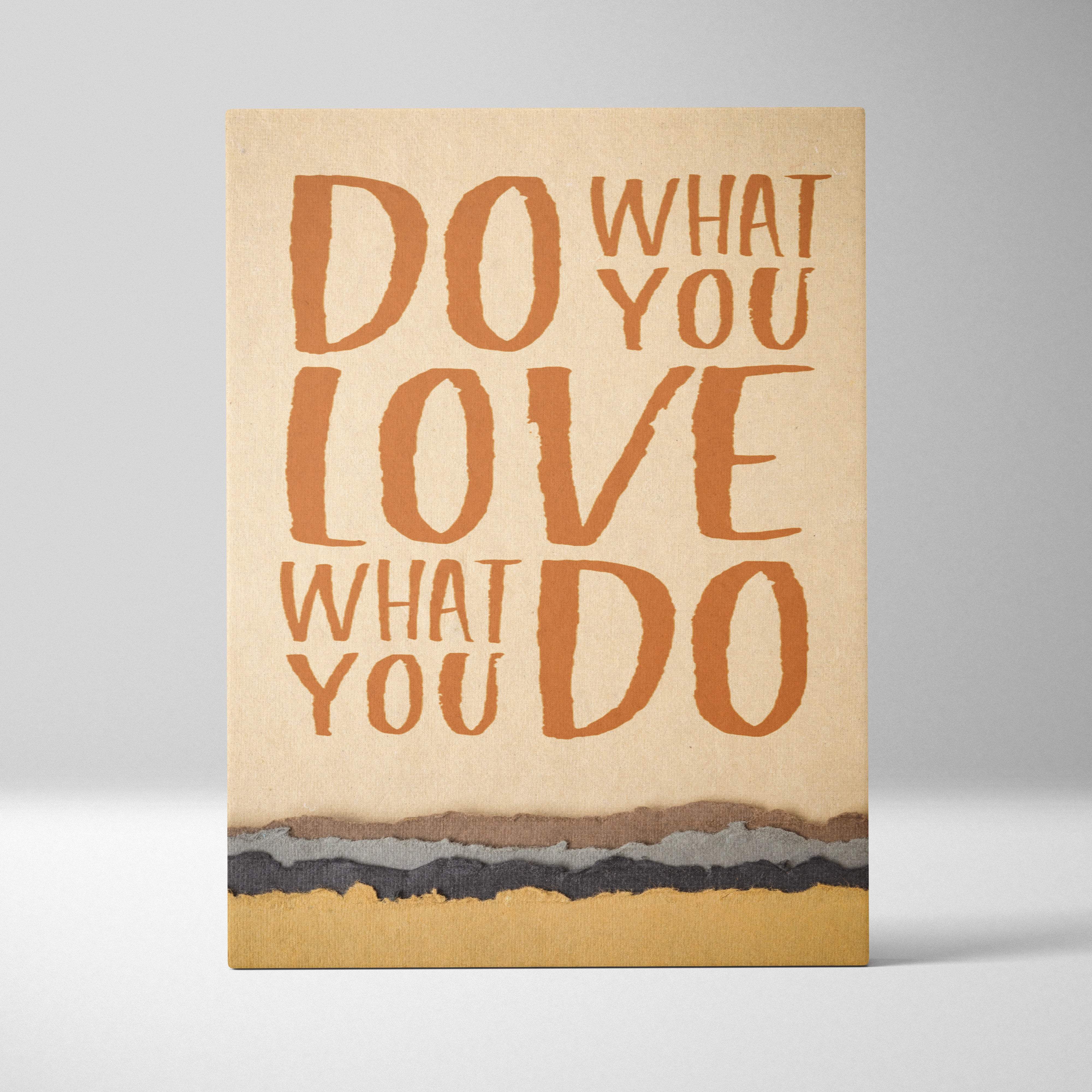 Beige canvas art with bold textured orange lettering featuring do what you love what you do motivational quote