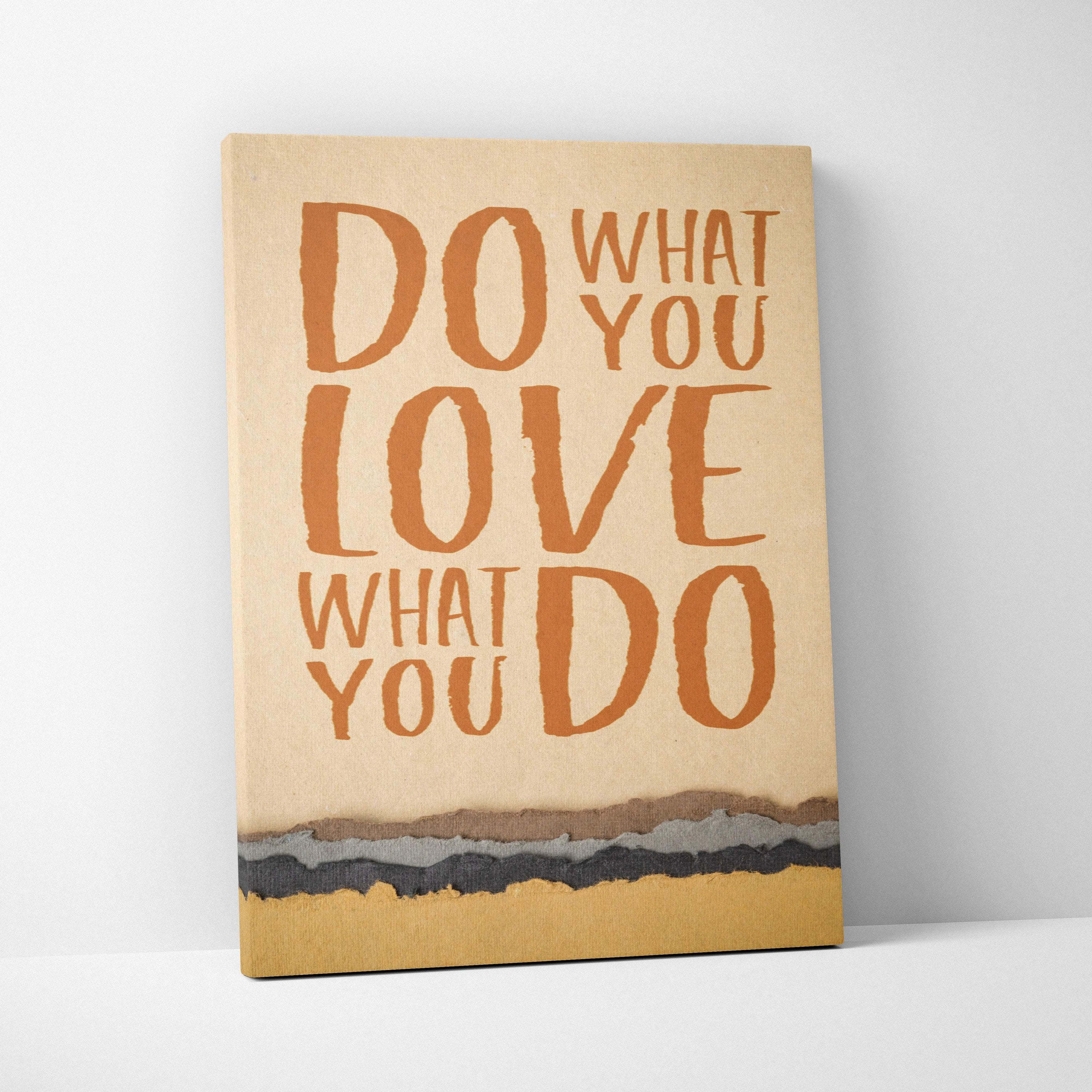 Beige canvas art print with bold textured orange lettering saying do what you love what you do and layered landscape design