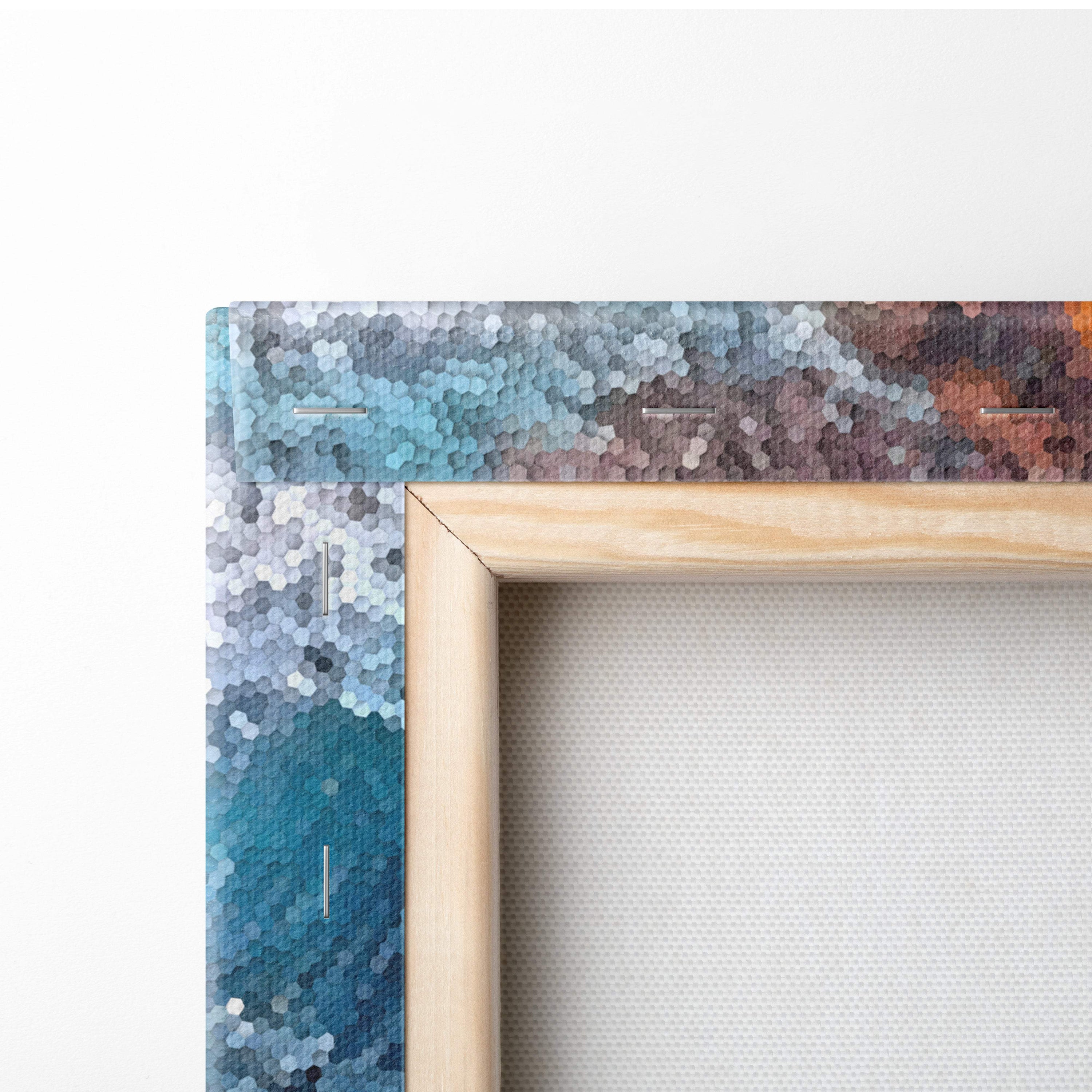 A wooden frame featuring a hexagonal mosaic pattern in shades of blue teal and brown for coastal living room decor