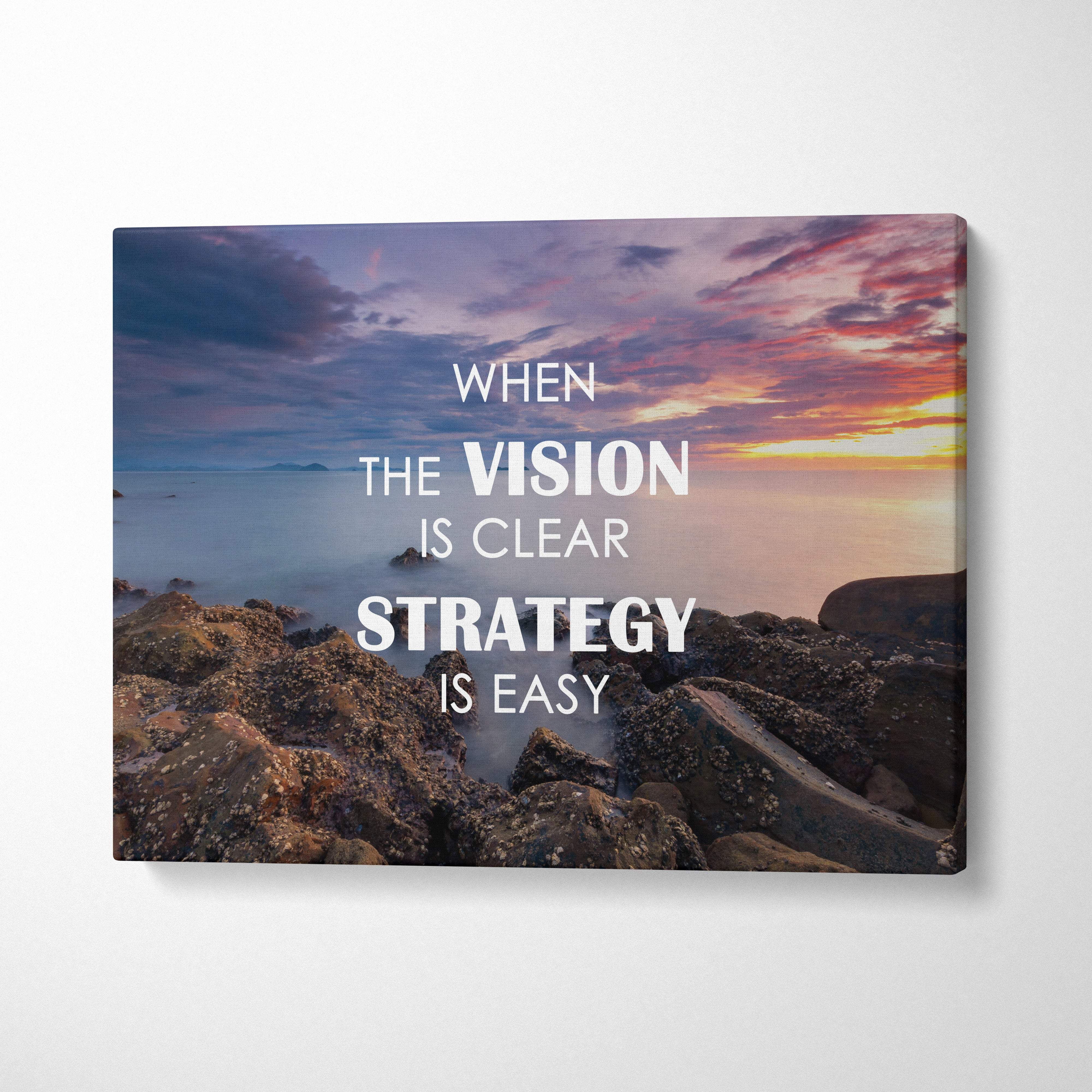 A rectangular canvas print with a serene sunset over rocky shoreline and bold white motivational quote for office decor