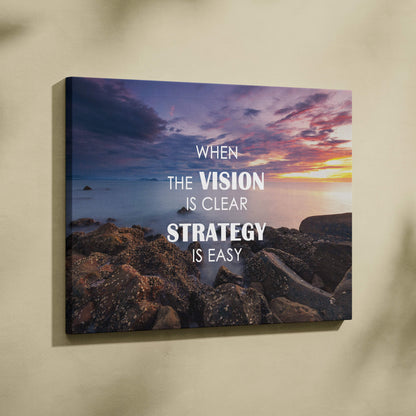 A rectangular canvas print of a serene sunset over rocky shoreline with bold white motivational text for office or home decor
