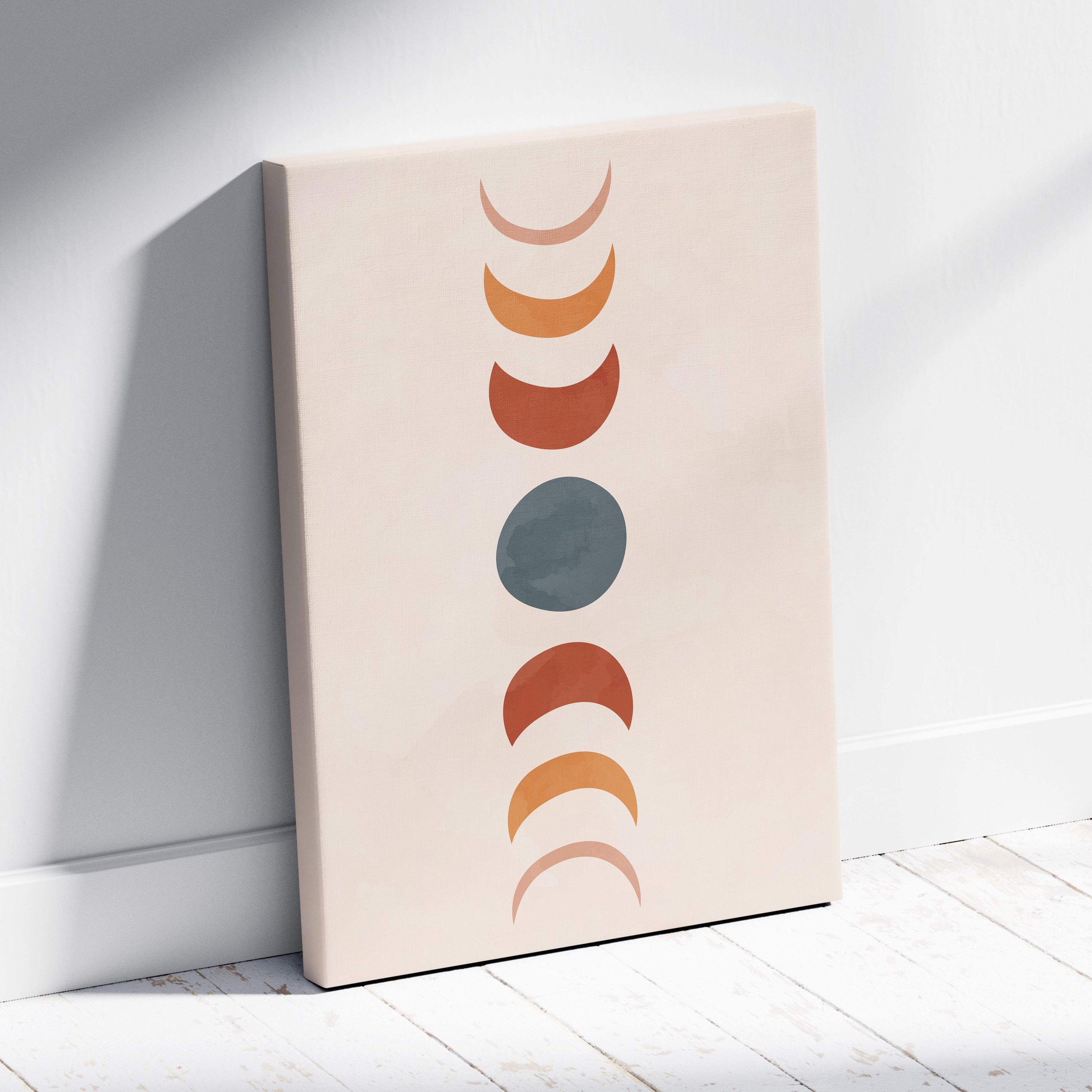 Beige canvas print featuring vertical stylized moon phases in terracotta rust and sage green for modern boho decor