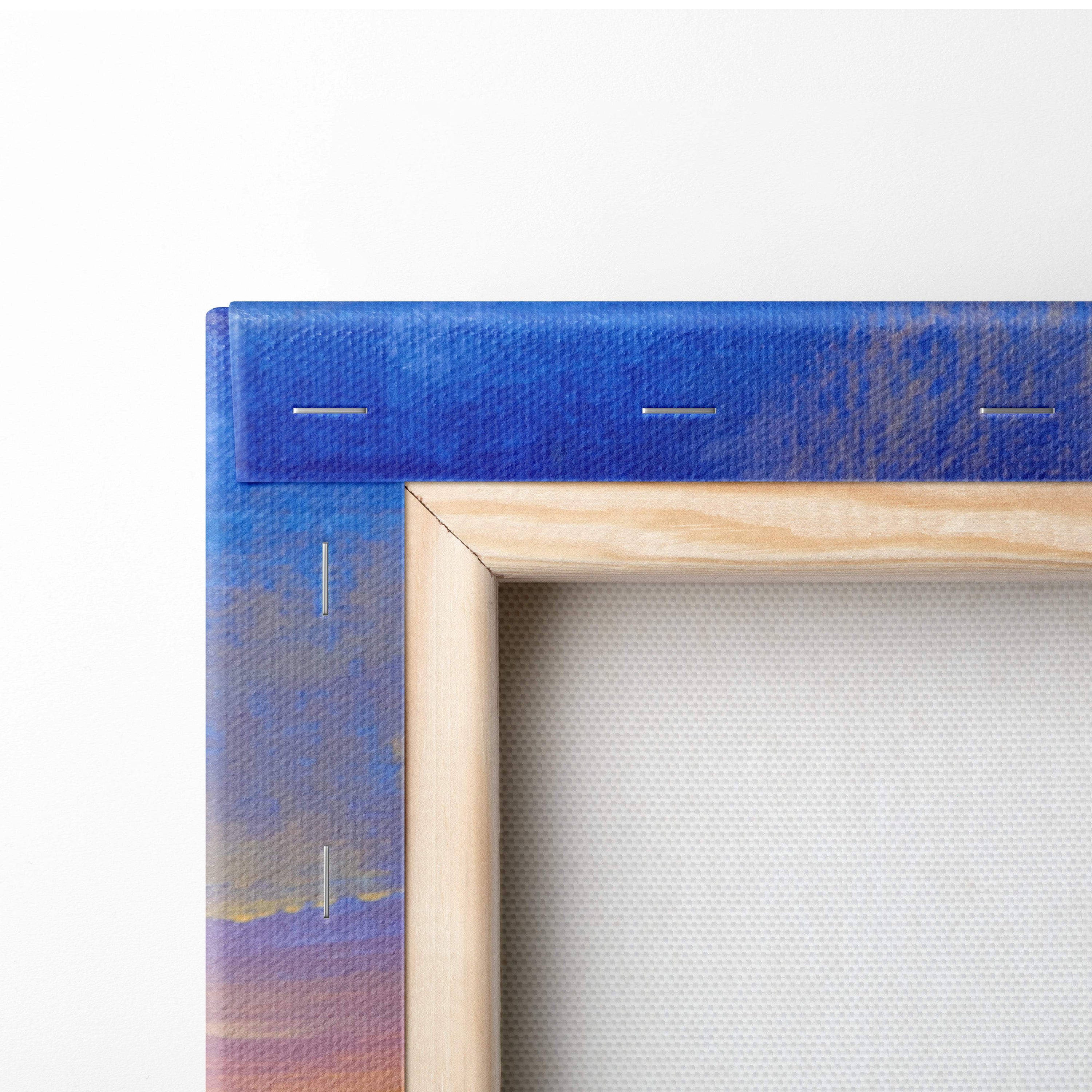 Blue canvas painting with wooden frame featuring colorful mountain wildflower landscape and golden sunset sky