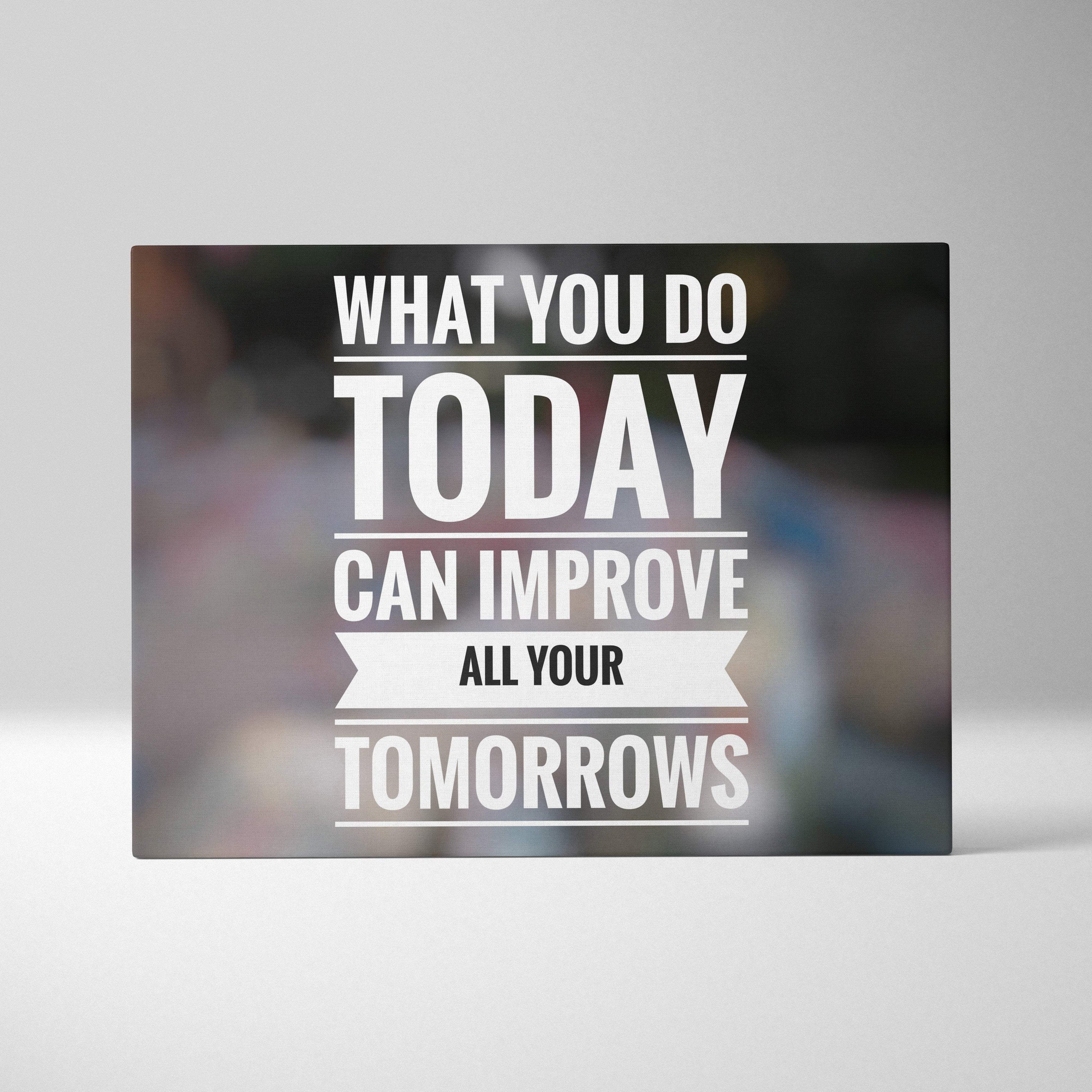 A sleek black rectangular canvas print with bold white motivational text and decorative banner for office or home decor