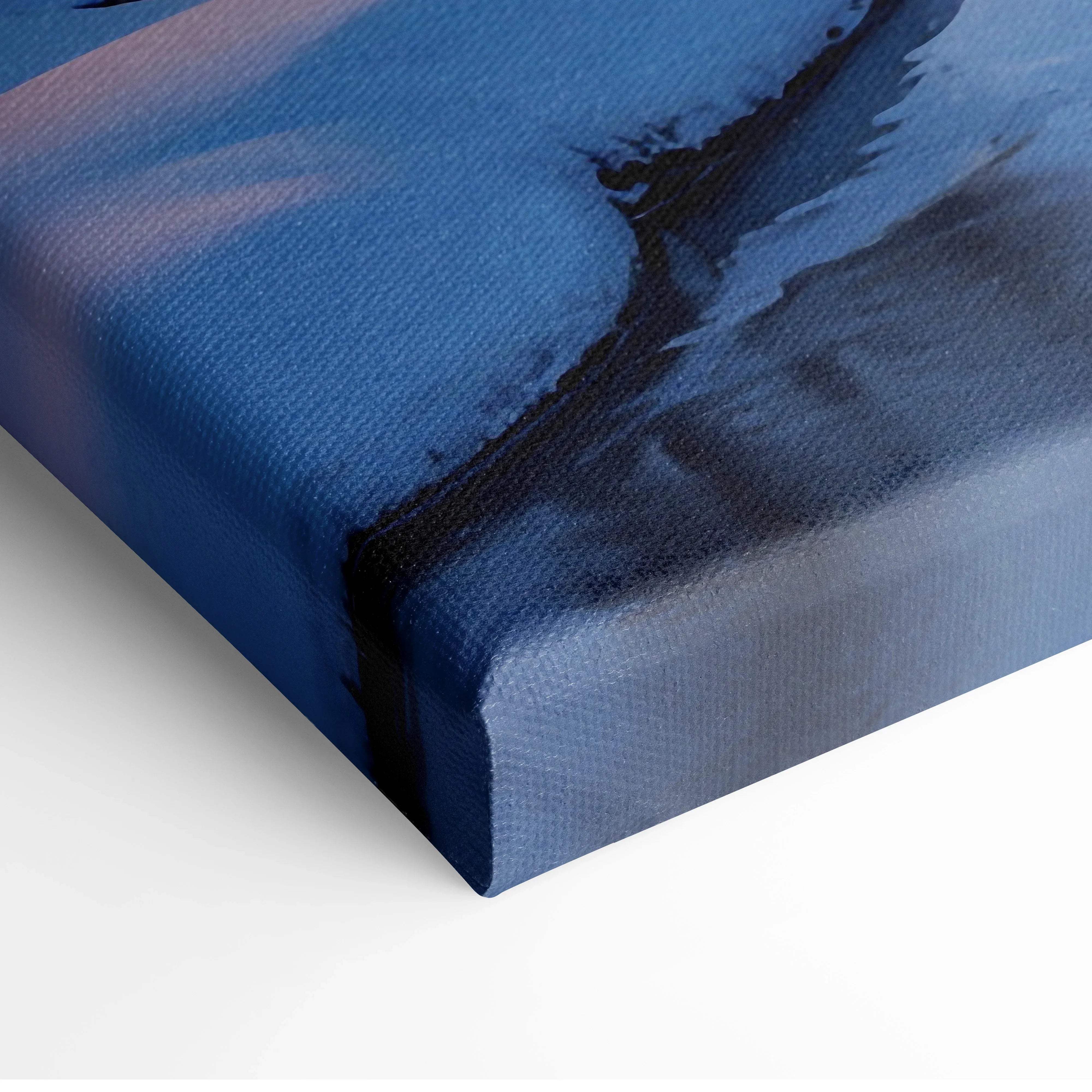 Blue canvas wall art with textured surface and abstract dark streaks depicting a winter landscape at sunset