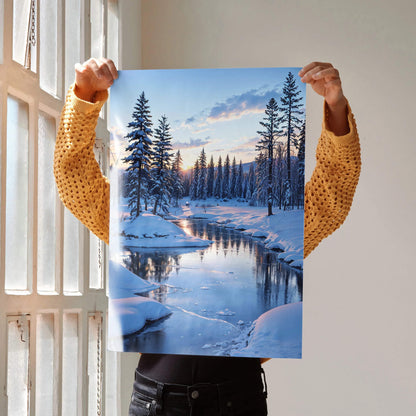 Vertical poster wall art featuring a snowy landscape with a river at sunset and pine trees.