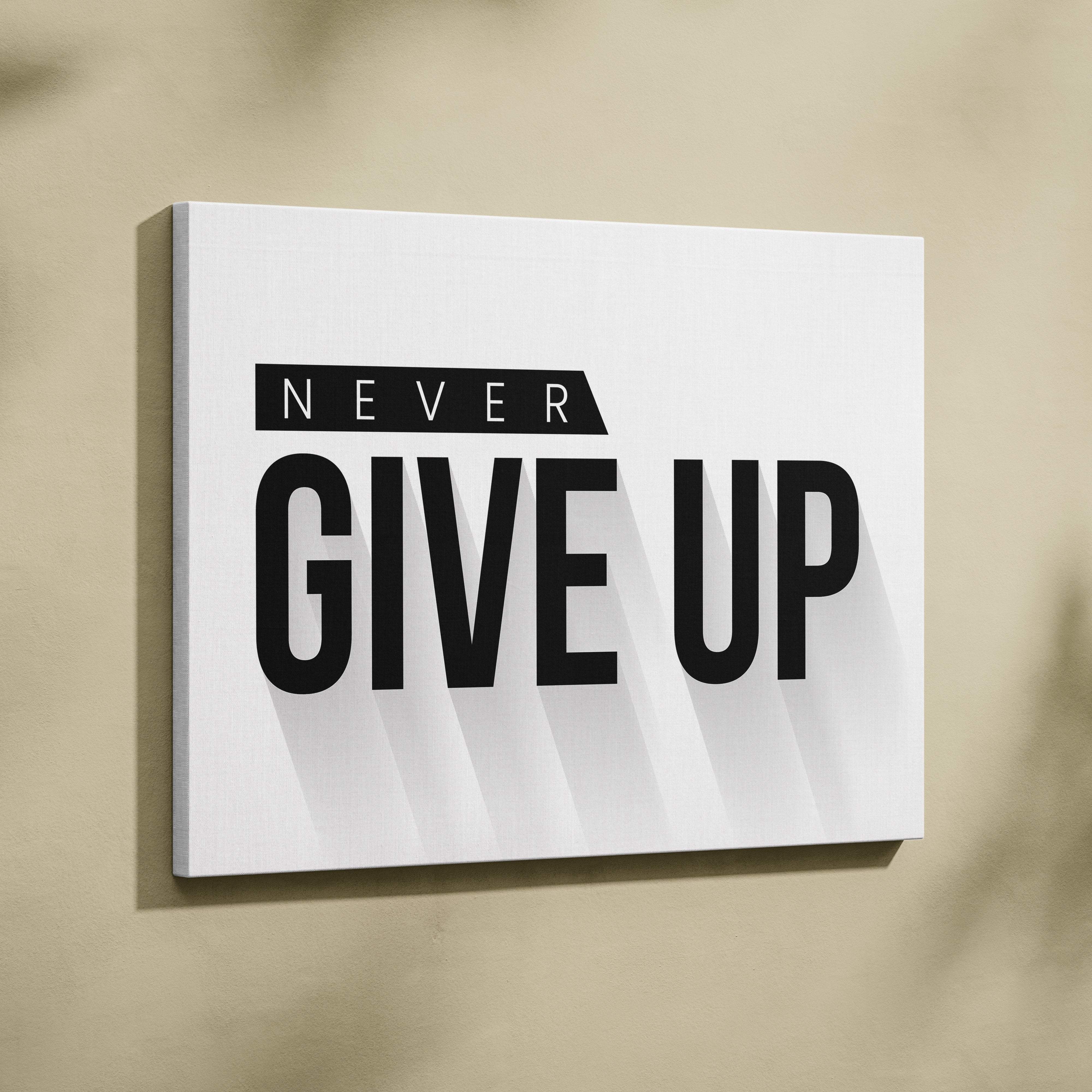 White canvas wall art with bold black never give up text in modern sans serif font for motivational decor