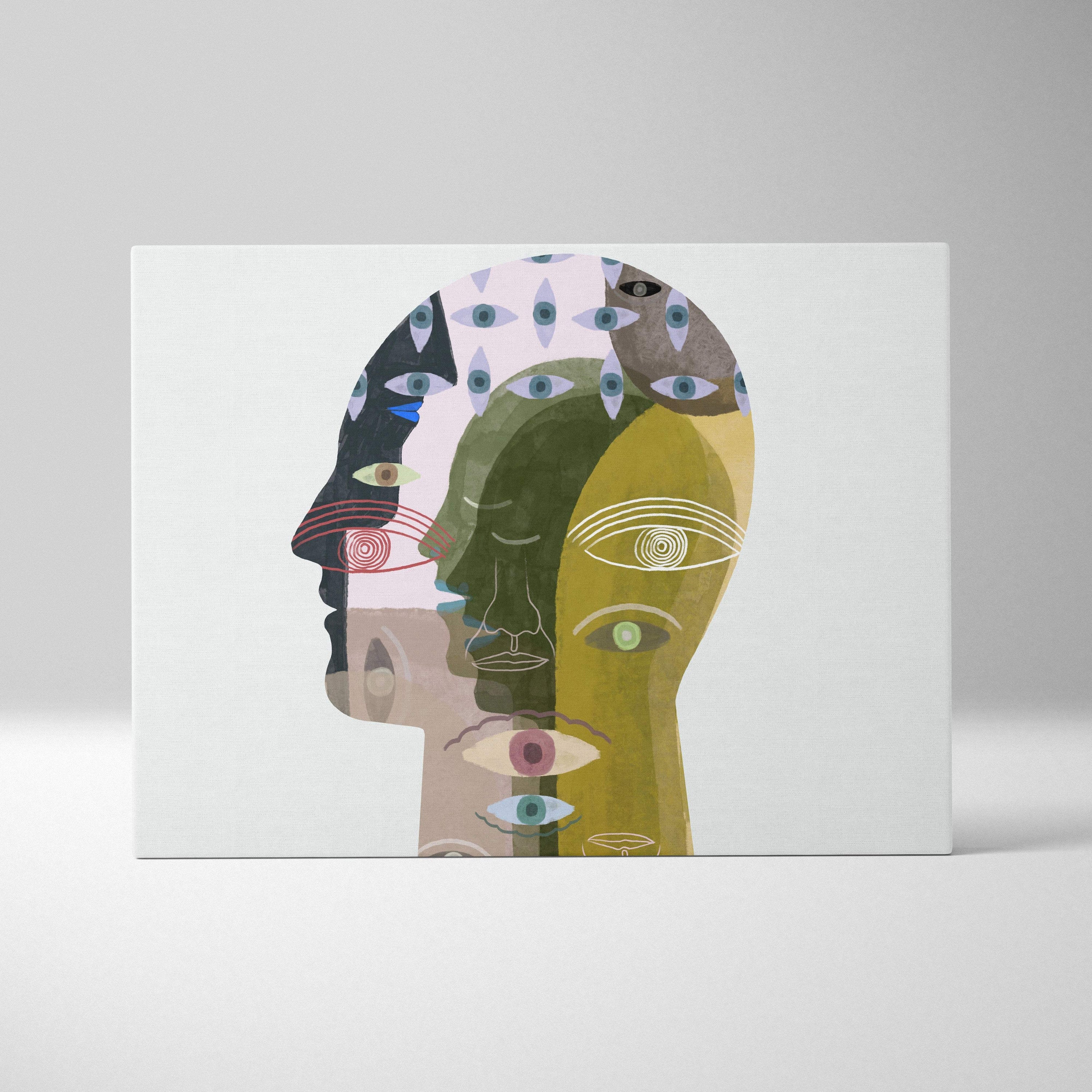 Contemporary abstract face canvas wall art featuring stylized overlapping faces with green and blue eyes in muted earth tones