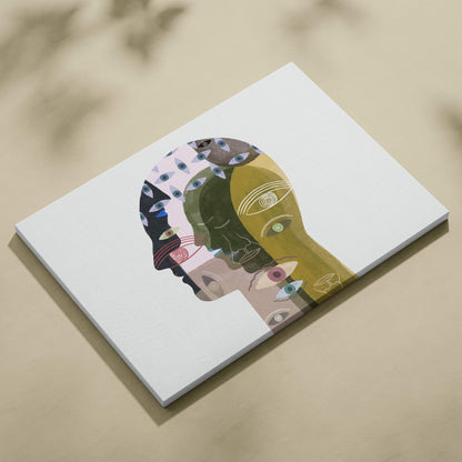 White canvas print of contemporary abstract face wall art with overlapping earthy and vibrant colors and eye patterns