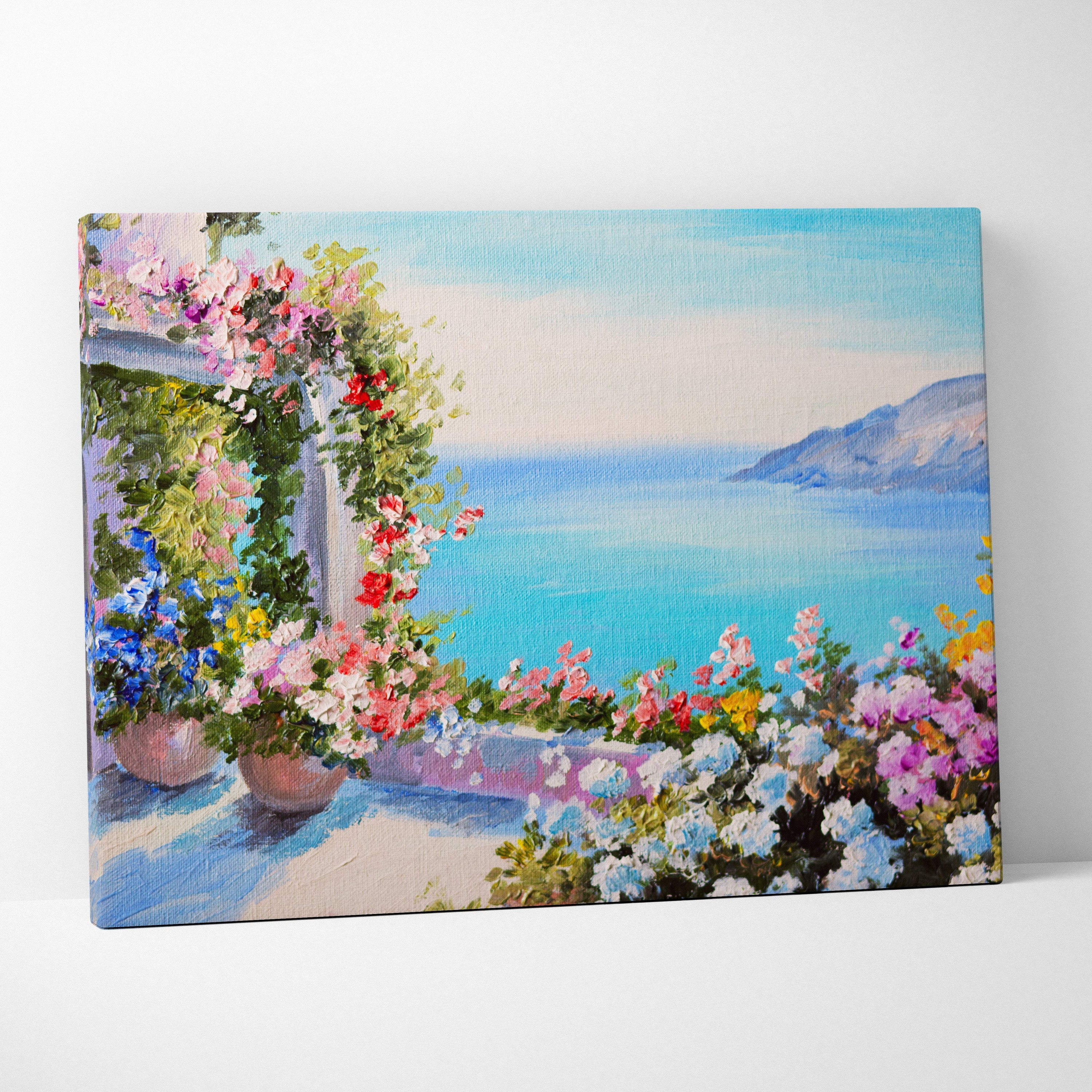 Mediterranean terrace garden canvas print of vibrant pink red blue and white flowers on stone balcony with sea view