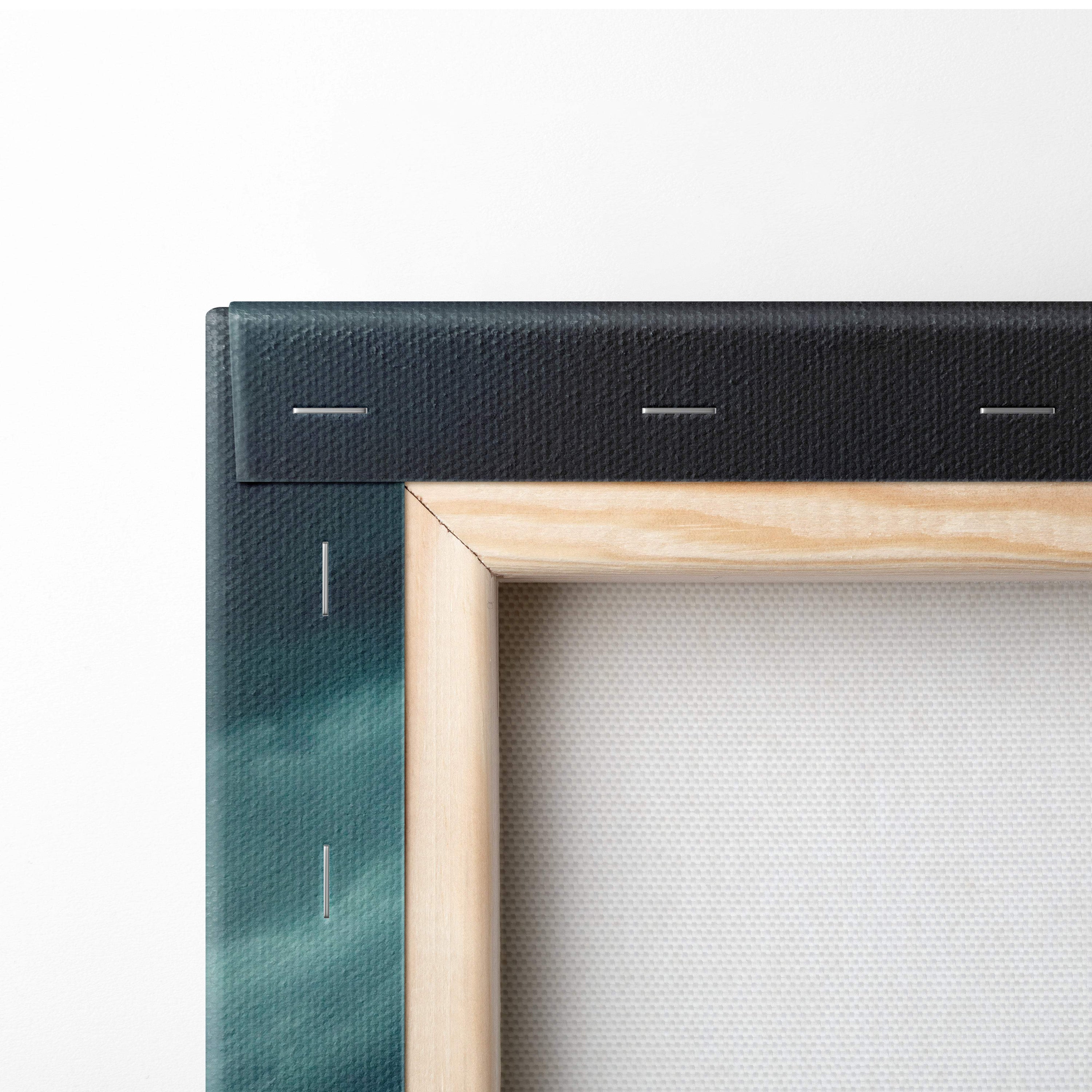 Stormy ocean waves canvas art with textured black and teal fabric border in a natural wood frame for coastal decor