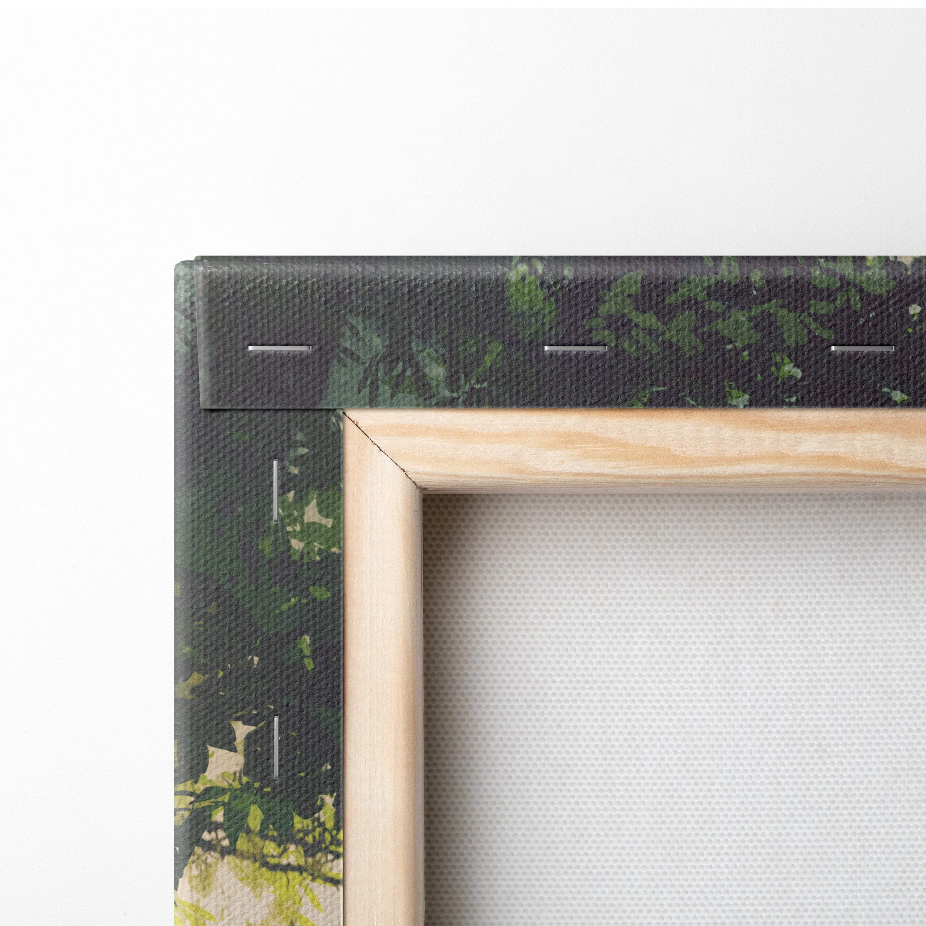Light wood-framed canvas wall art featuring a dark green leafy design inspired by enchanted forest guardian fantasy illustration