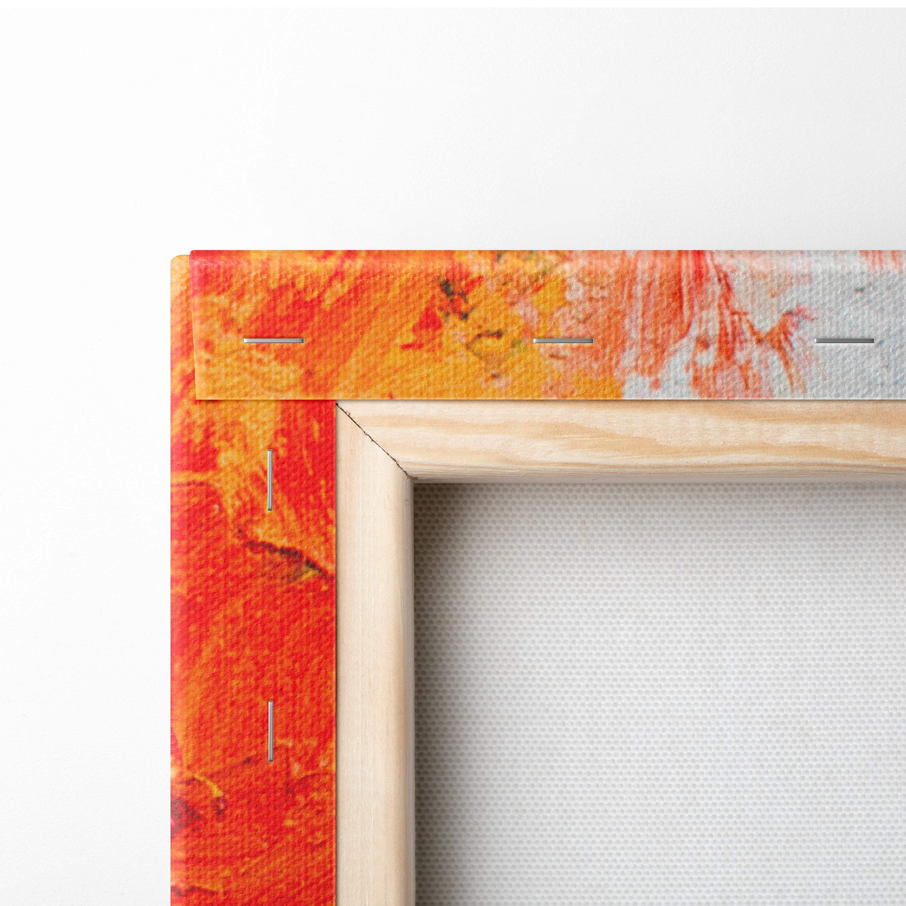 A vibrant orange and red abstract canvas wall art print with light wood frame for rustic living room decor