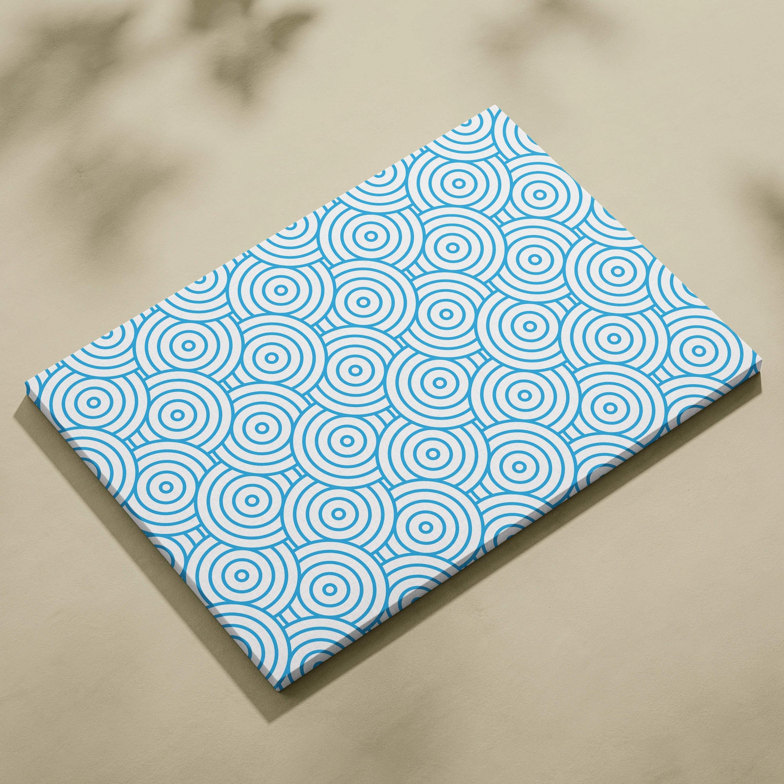 Modern blue concentric circles pattern on white canvas wall art