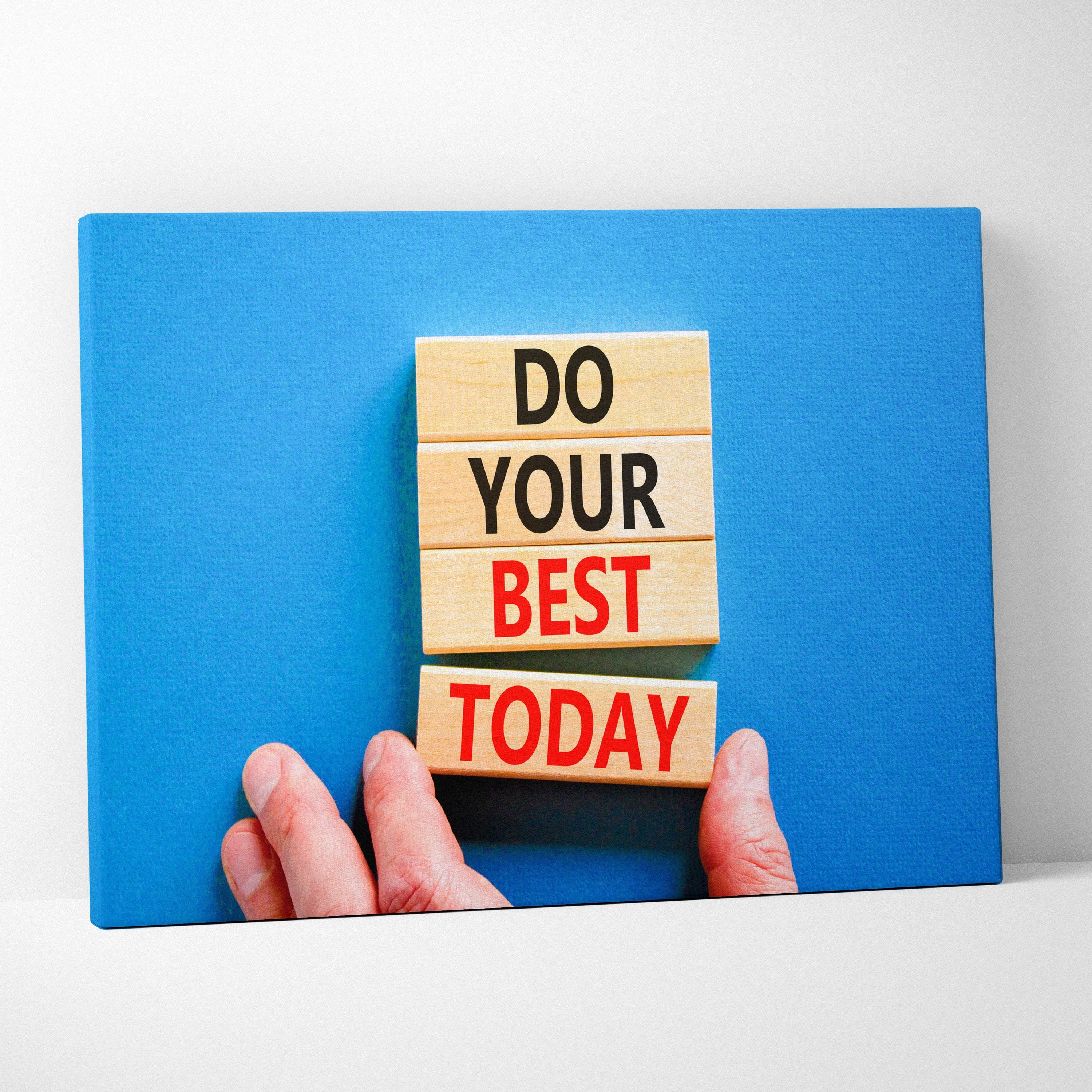 Do your best today motivational quote wall art print showing light wood blocks with black and red lettering held by fingers