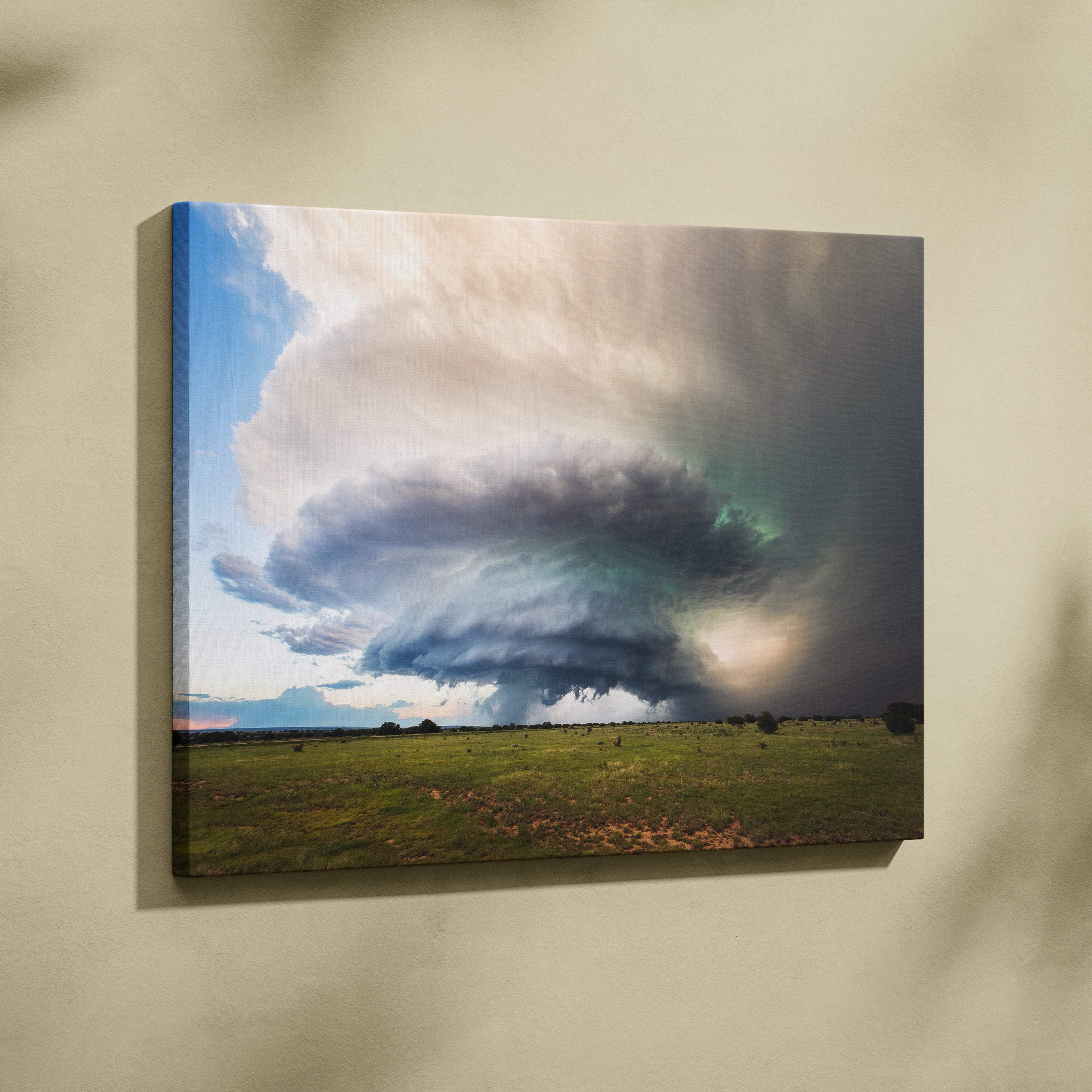 A canvas print of a supercell storm cloud in dark moody green over a dramatic cinematic open field landscape
