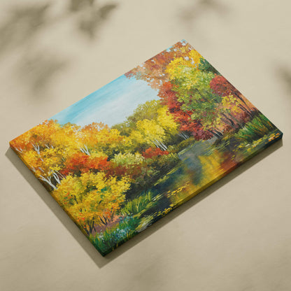 Bright autumn lake canvas wall art print of vibrant yellow orange and red trees reflected in a serene pond under blue sky