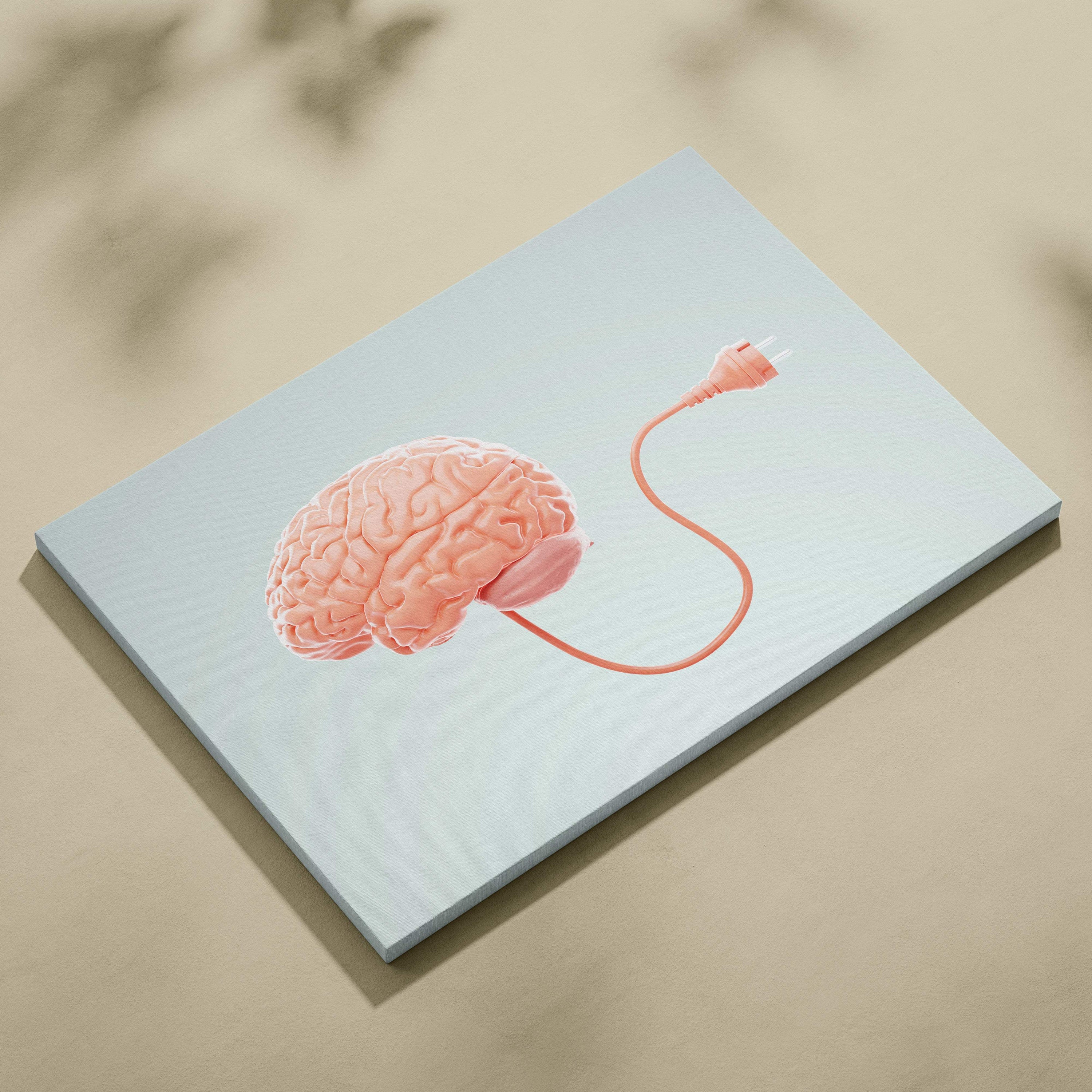 Contemporary canvas print of a peach brain connected by an orange cord on light gray background for modern psychology decor