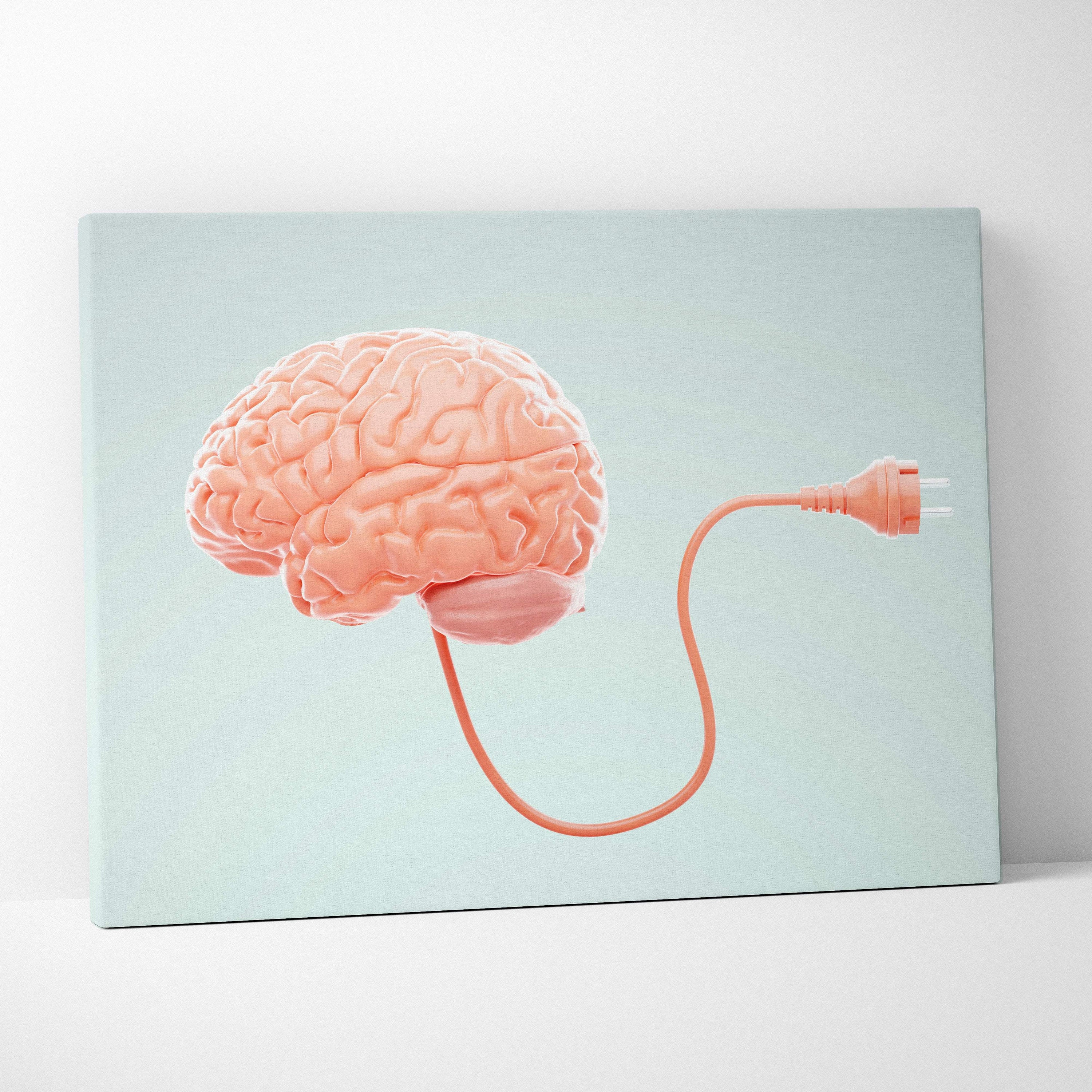 A peach-colored canvas print of a stylized brain with an orange plug on a mint green background for mental health decor