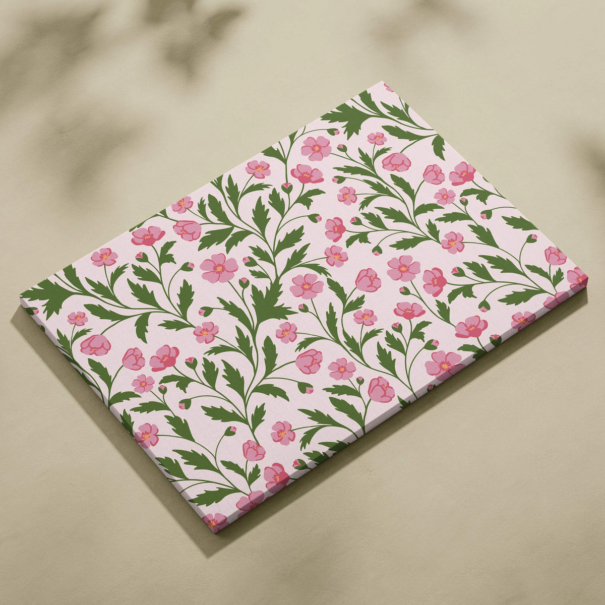 Seamless pink floral pattern canvas wall art with green leafy vines on soft blush background