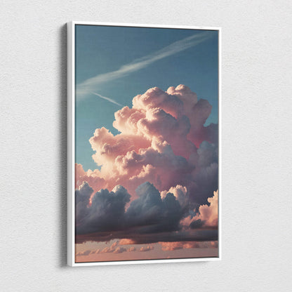 A framed canvas print of towering pink cumulonimbus clouds at sunset with soft pastel sky and dramatic cloudscape