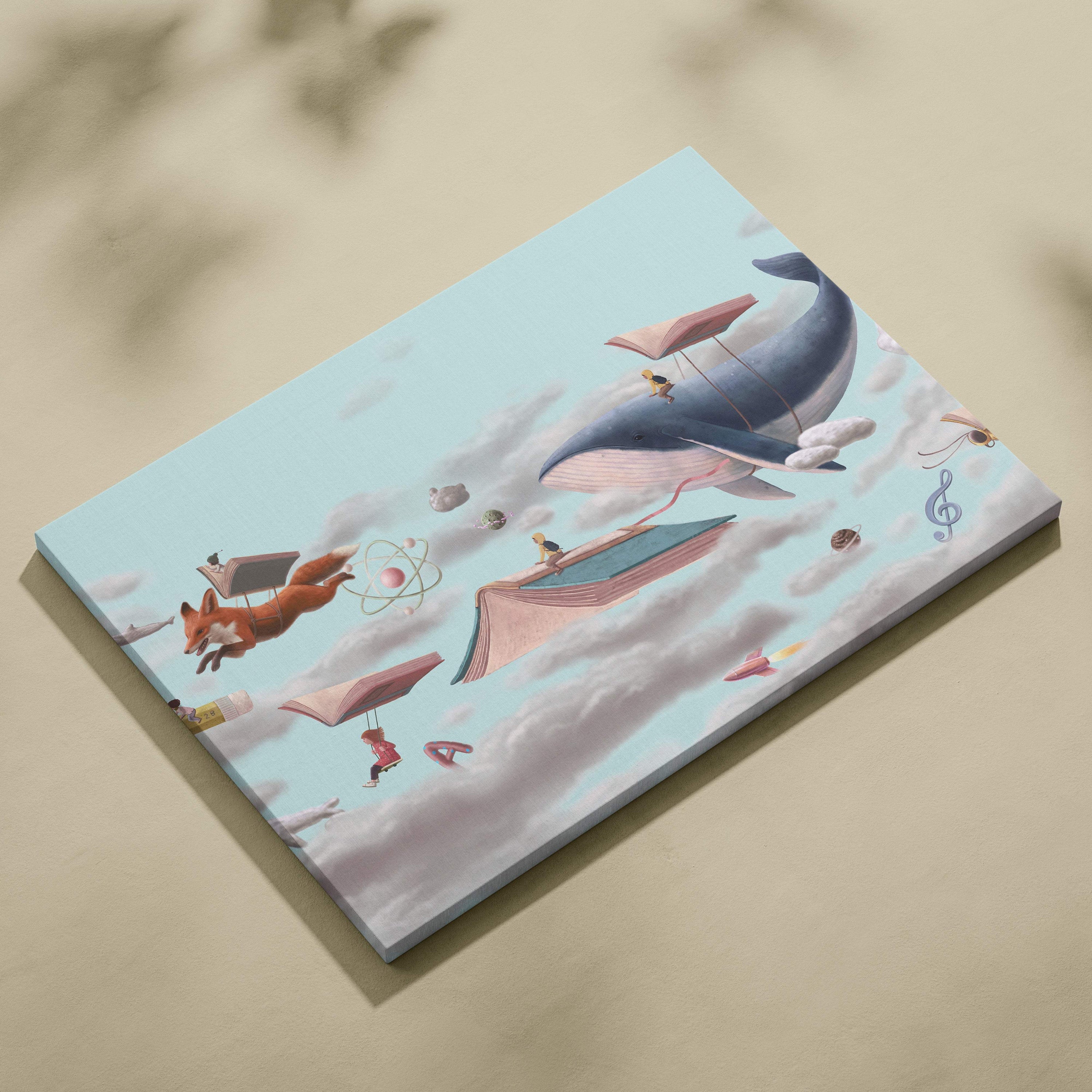 Contemporary canvas wall art featuring a blue whale with pink underbelly and flying open books surrounded by foxes and clouds