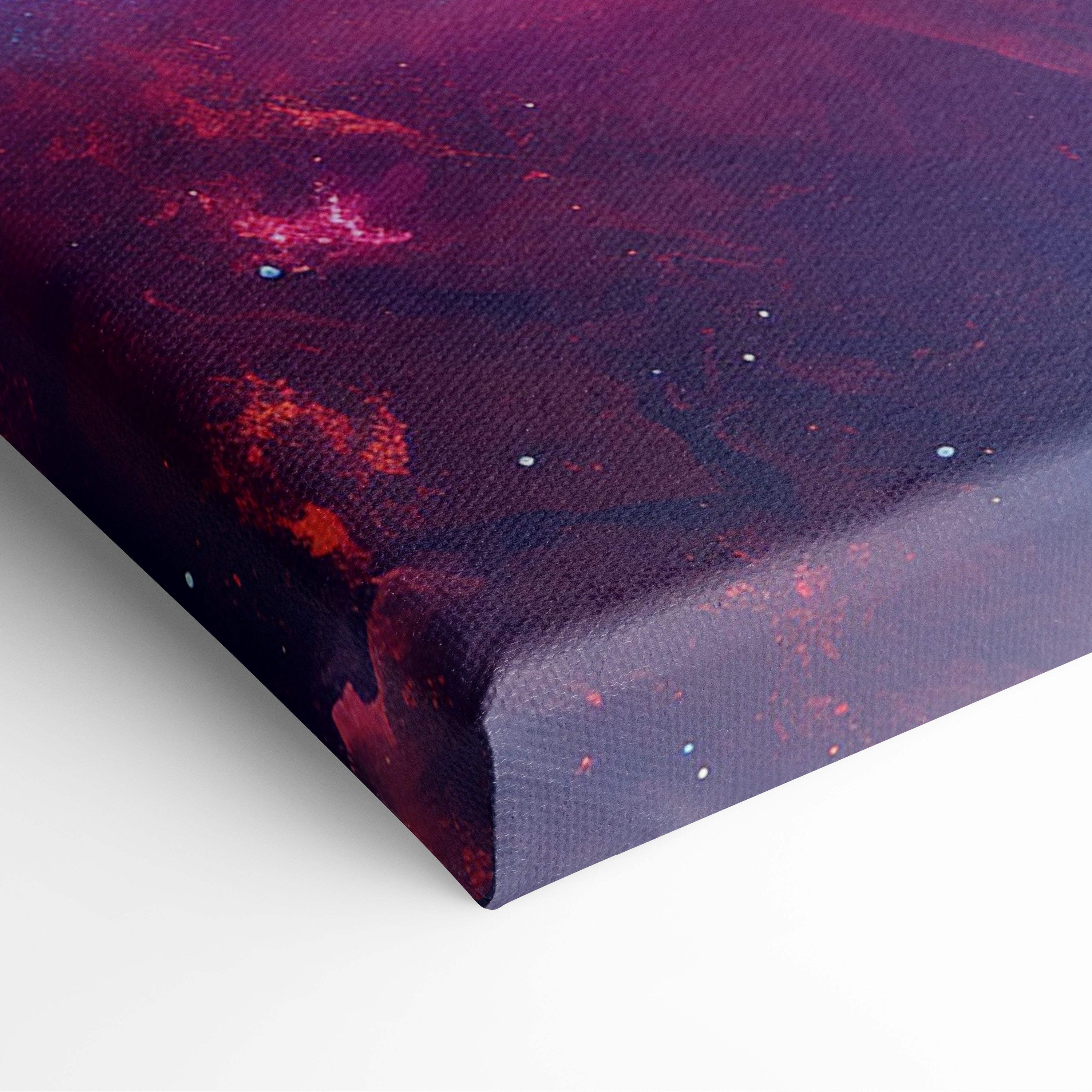 Cosmic nebula canvas wall art print featuring a deep purple and red galaxy spiral on textured canvas for dreamy rooms