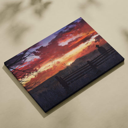 Rectangular canvas print of a western sunset with fiery orange and purple clouds over a silhouette by a wooden fence