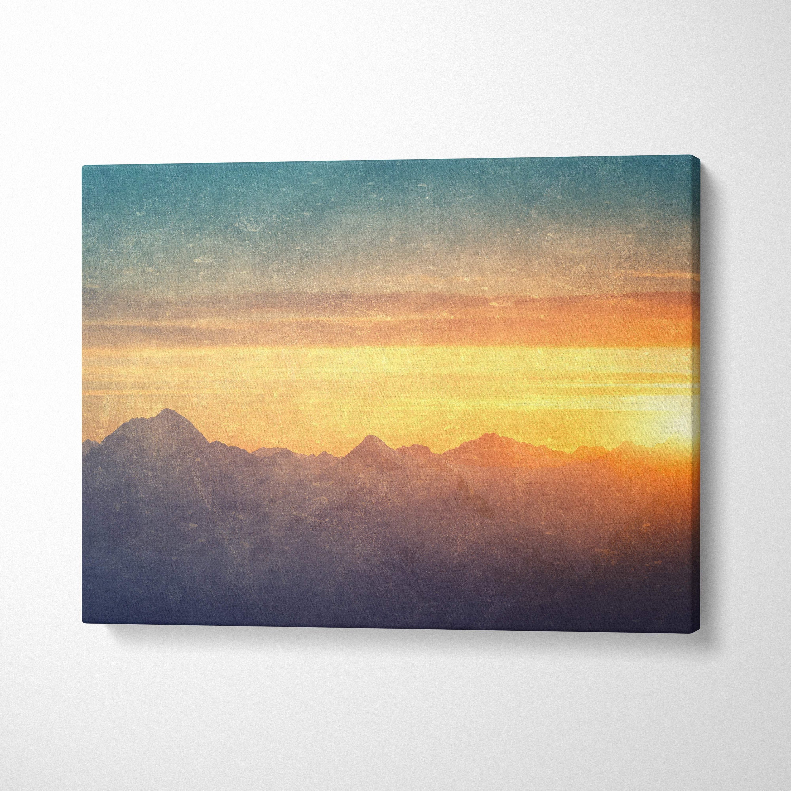 Golden mountain sunset canvas wall art print featuring a serene orange and teal mountain range landscape for rustic decor