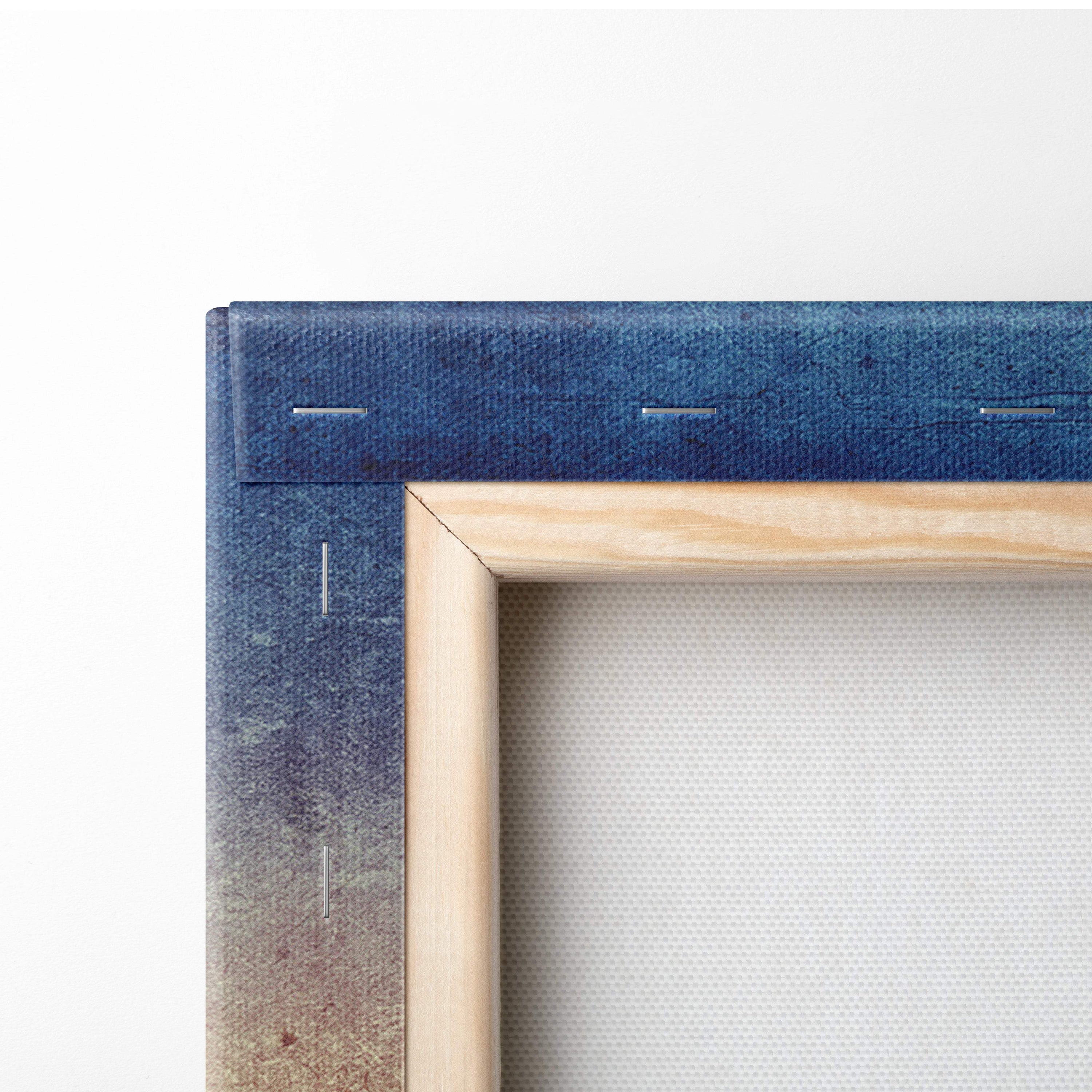 Blue textured canvas wall art print with visible stitching in light wood frame for rustic living room decor
