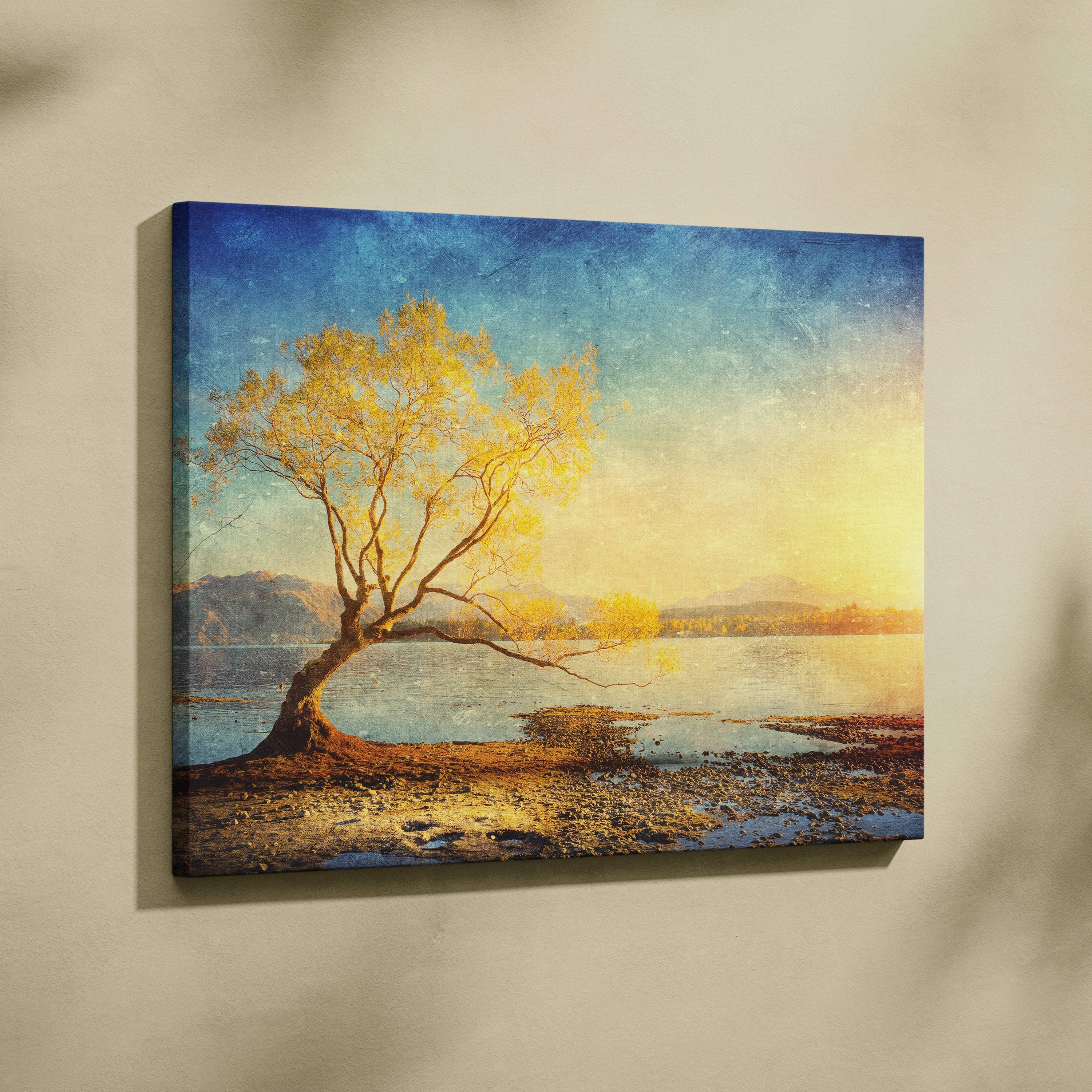 Golden lake tree sunset canvas wall art print with a solitary golden tree by teal blue mountains and calm waters