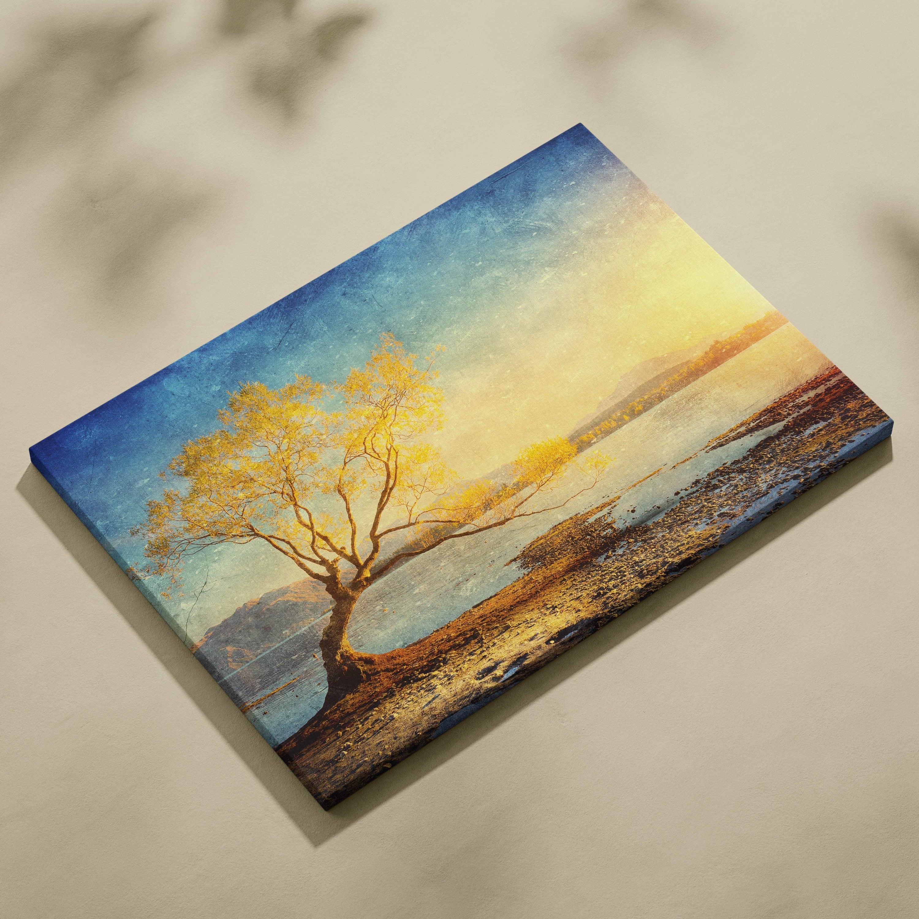 Rectangular canvas print featuring a solitary golden leaf tree against a vibrant sunset sky over water in acrylic paint